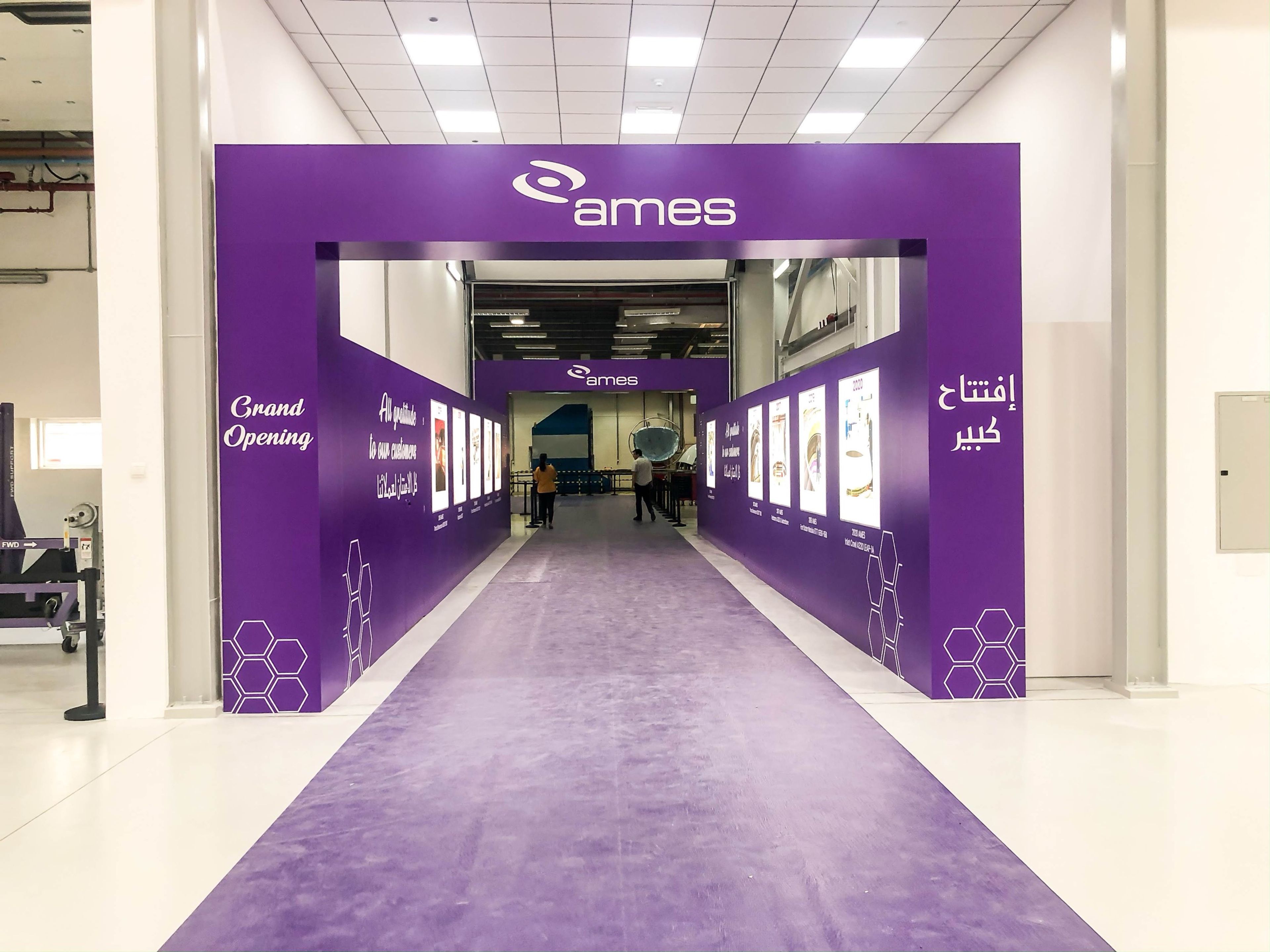 Branded purple entrance tunnel for a facility grand opening