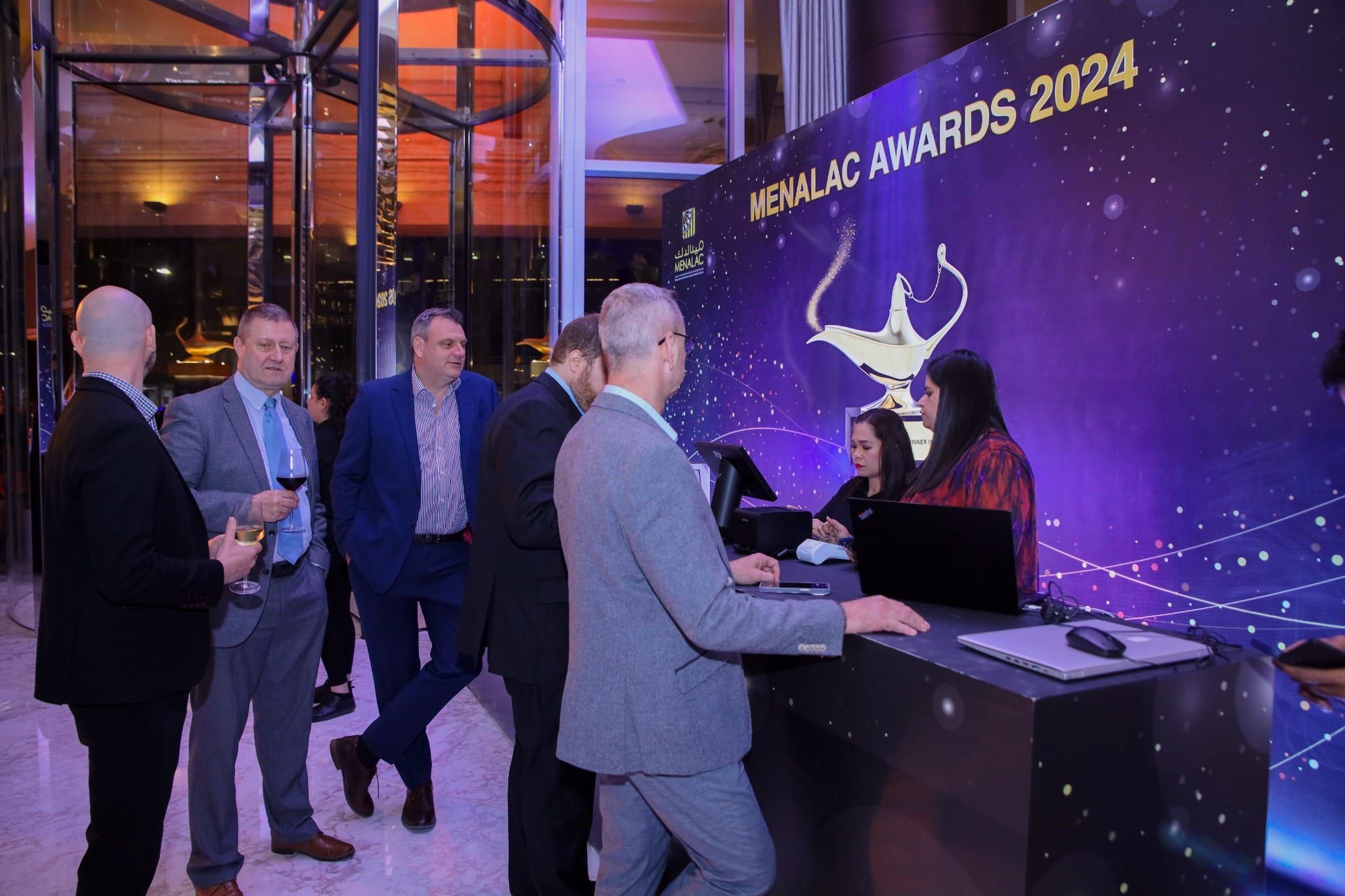 Guest registration desk with MENALAC Awards 2024 branding