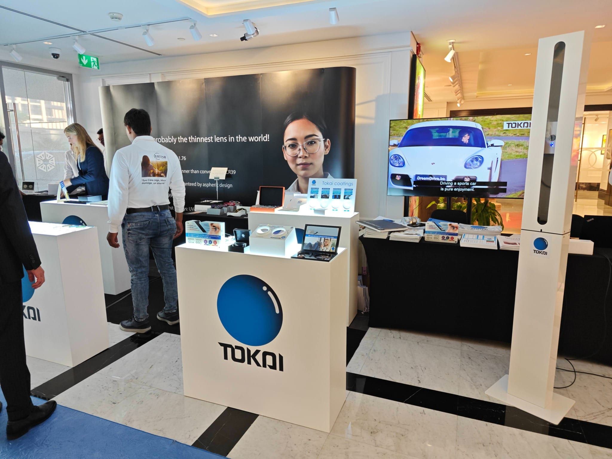 Tokai Optical lens product exhibition counters with branded displays