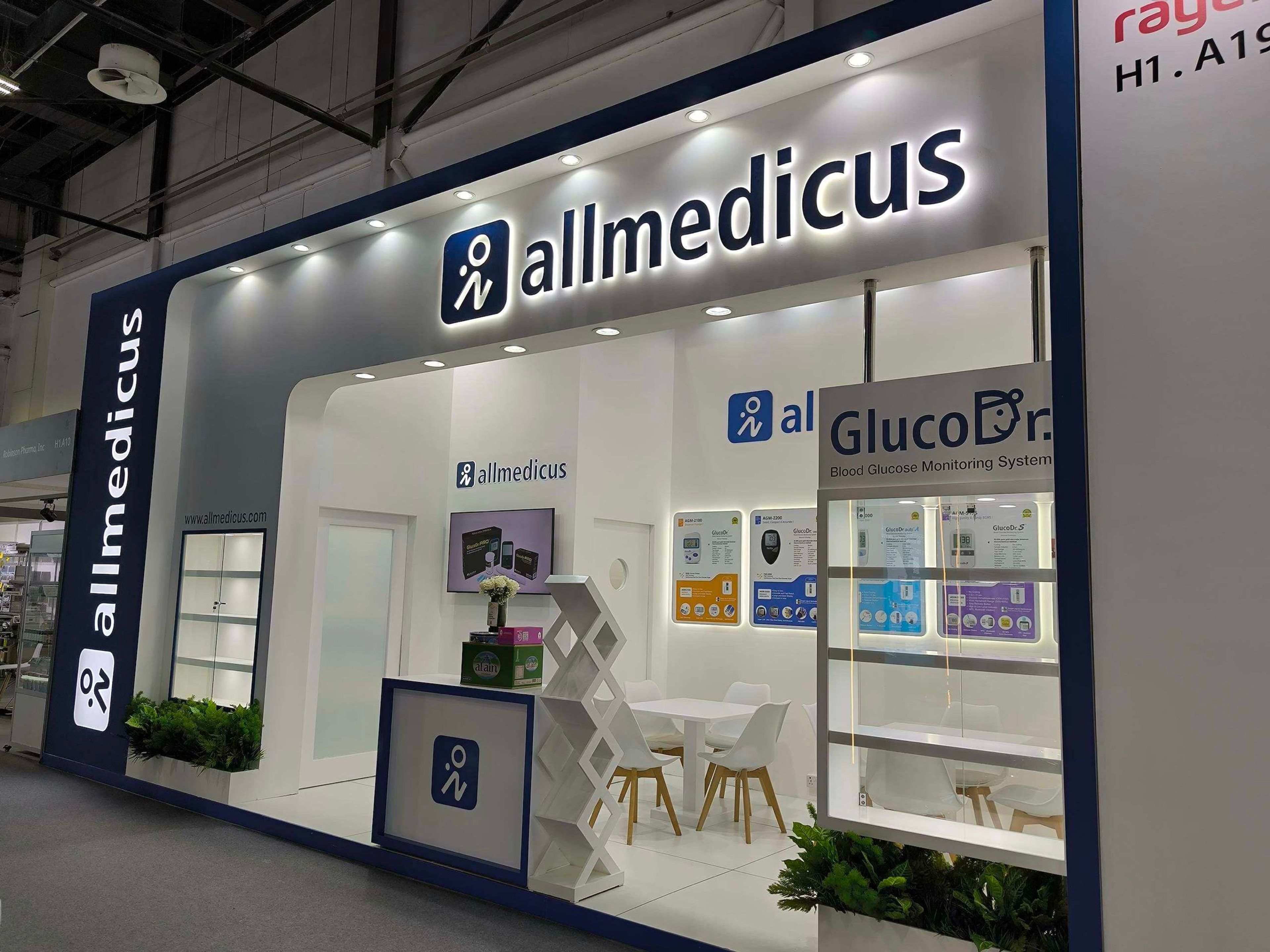White exhibition stand with branded signage for a healthcare company