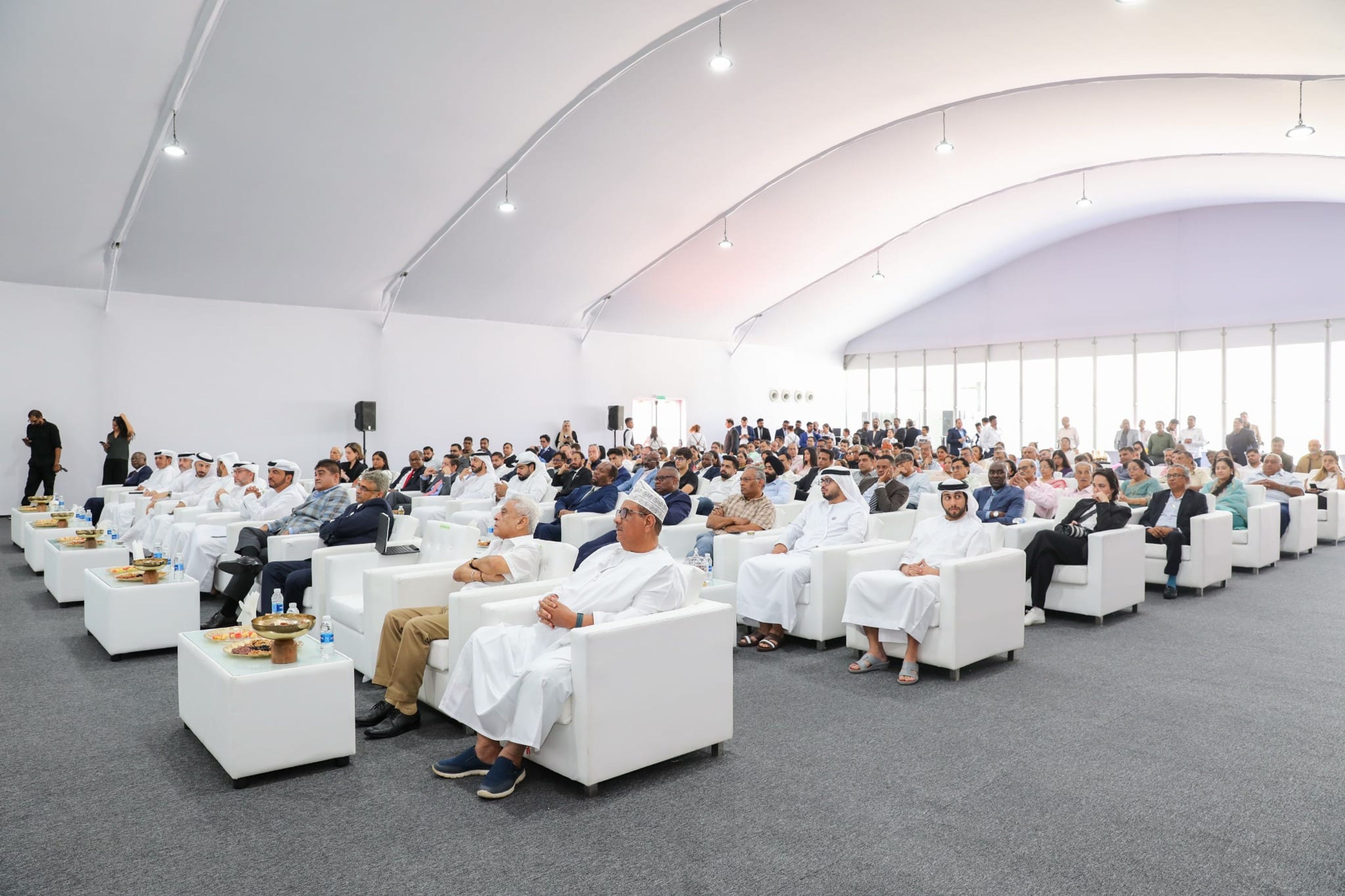 Guests in lounge seating inside the tent at the Neelkanth Cables factory opening