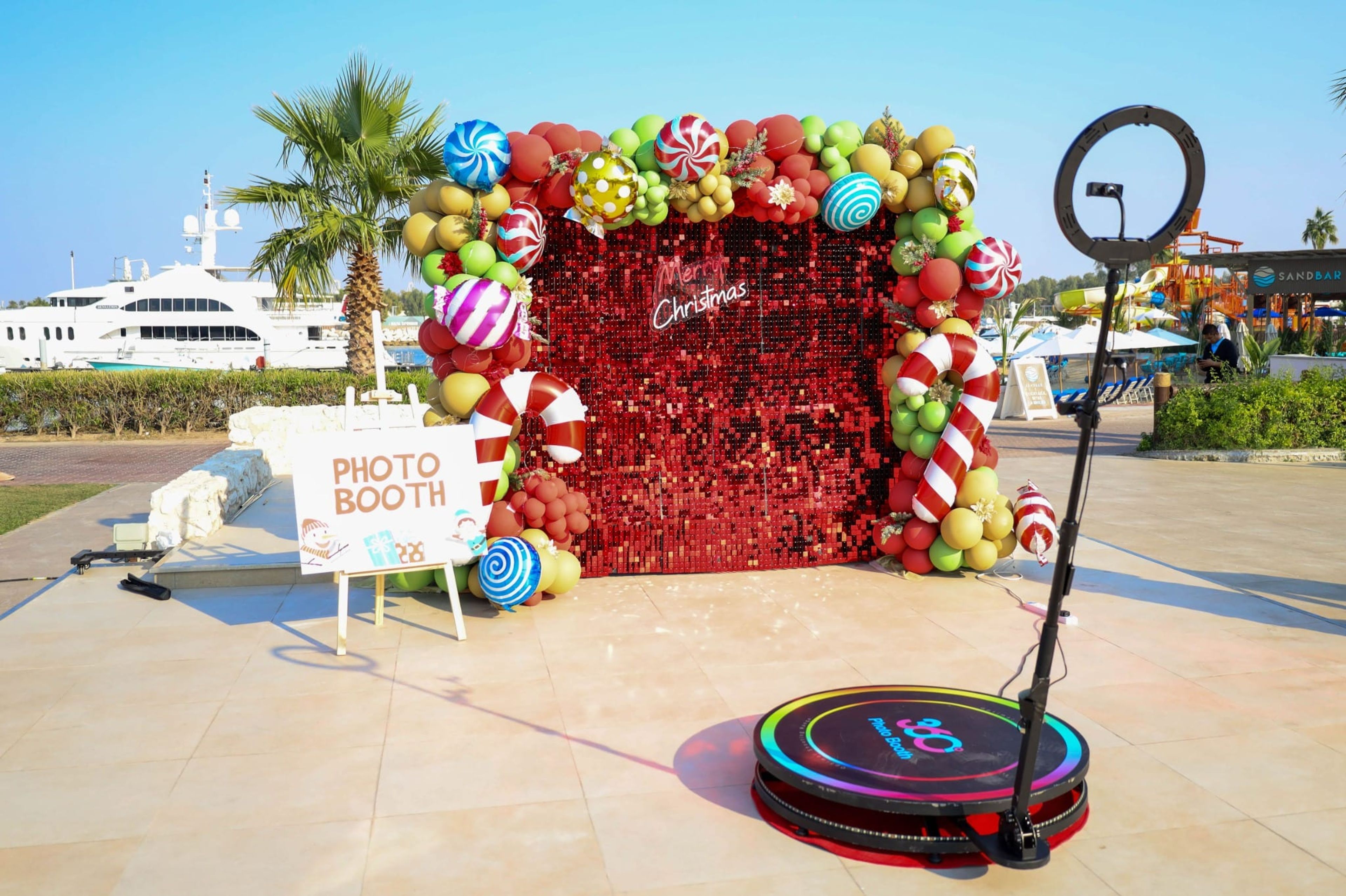 Candy-themed Christmas photo booth with a 360 video platform