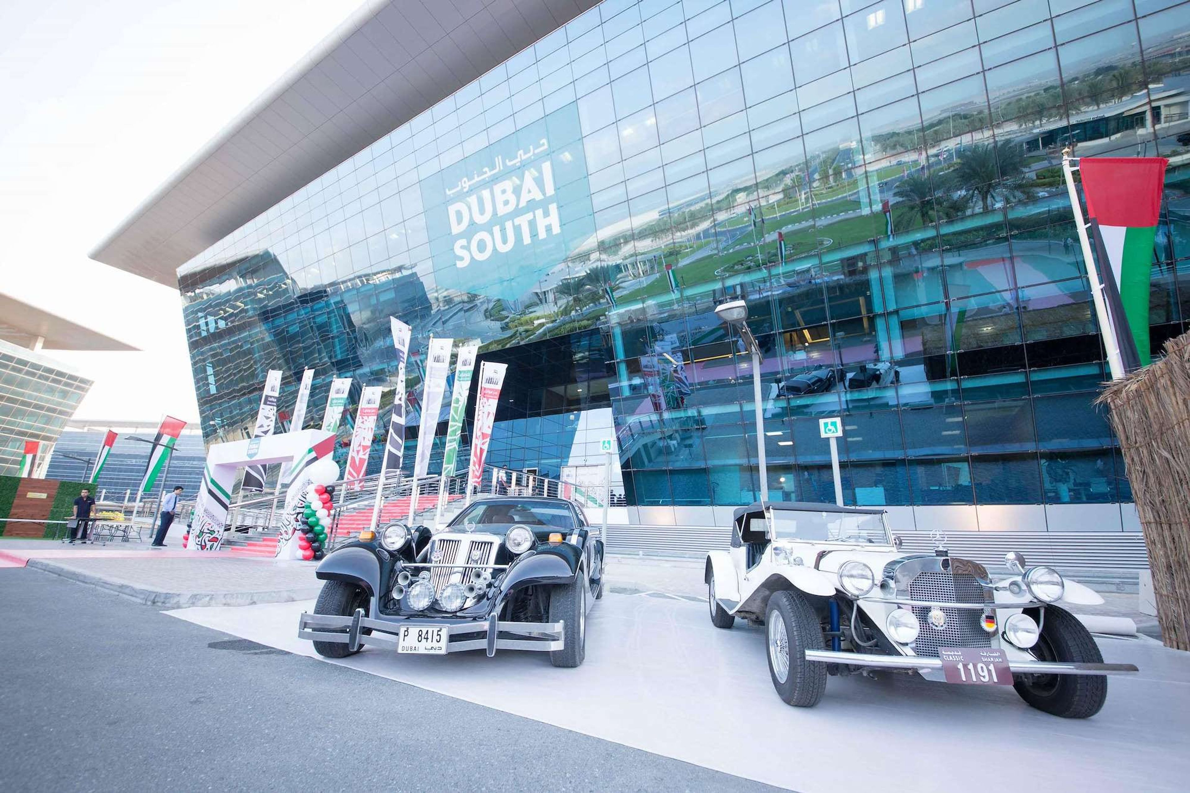Vintage cars on display in front of a Dubai headquarters for a corporate UAE National Day celebration