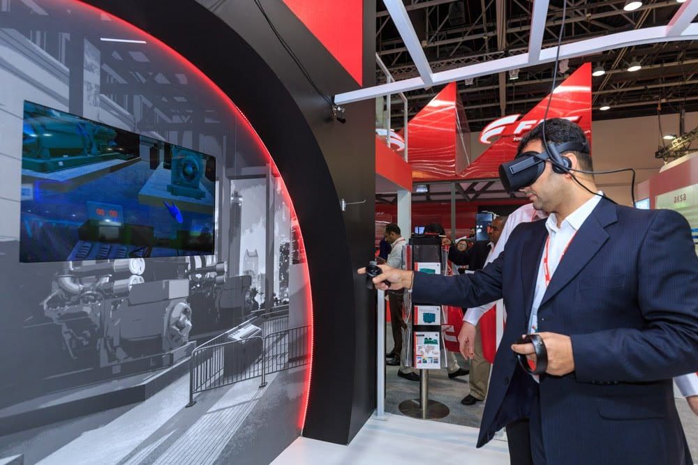 Visitor using a VR headset on the Cummins stand at Middle East Energy