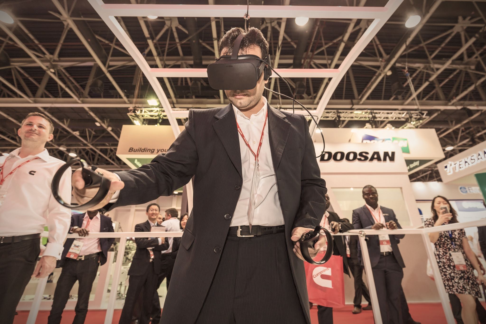Visitor trying a virtual reality headset at an exhibition stand