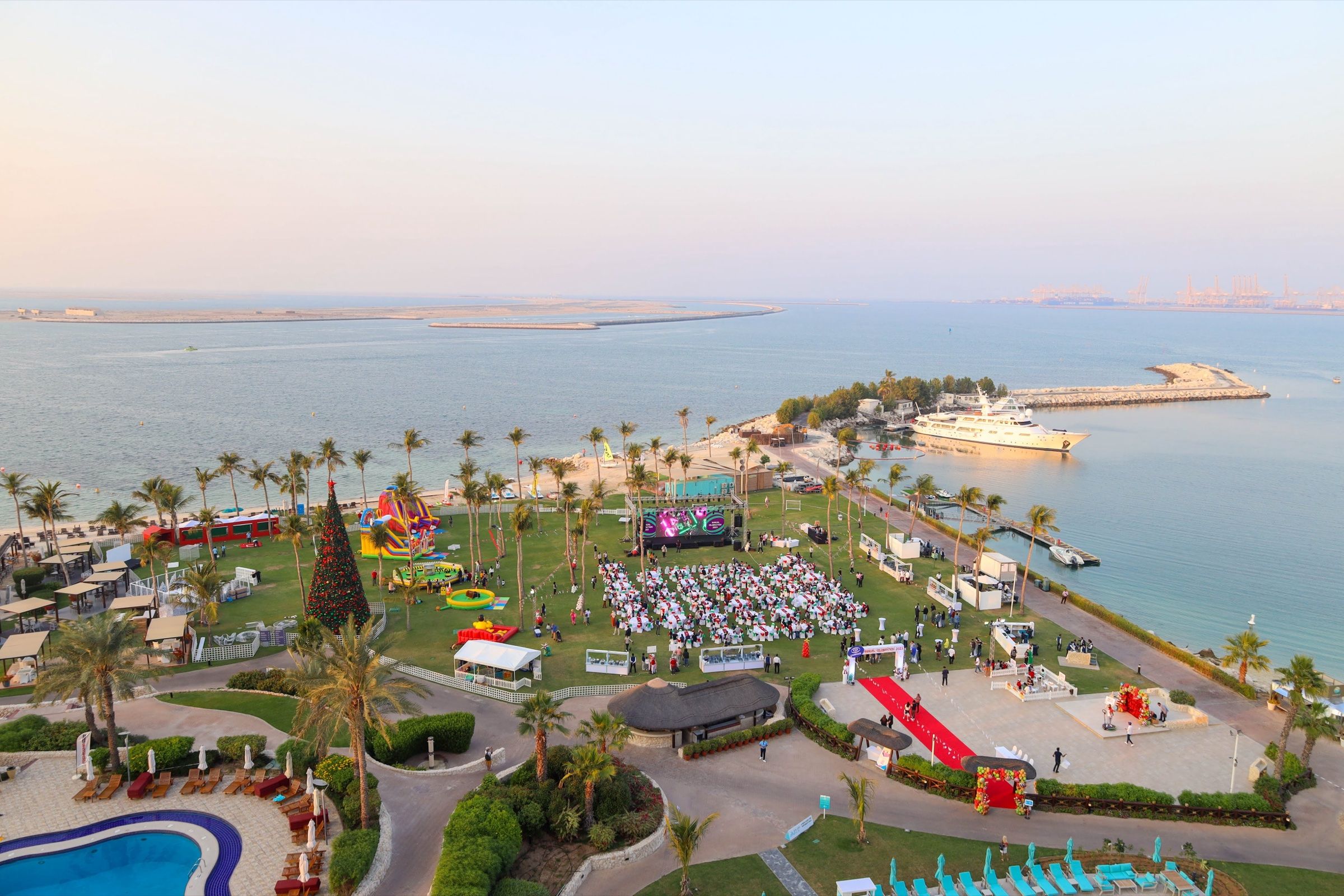 Aerial view of a beachfront outdoor event site in Dubai