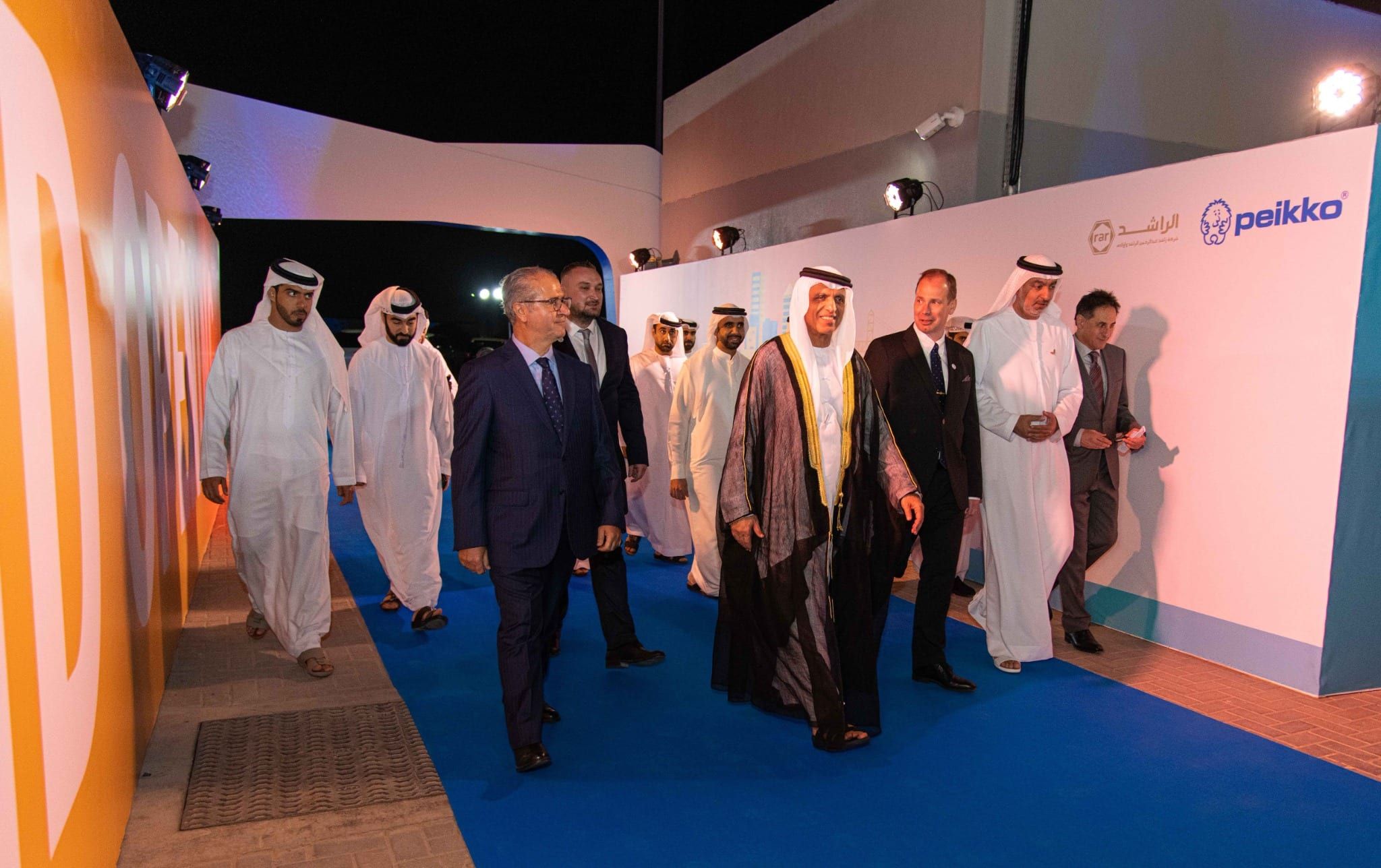 VIP guests arriving along the blue carpet at the Peikko Gulf facility