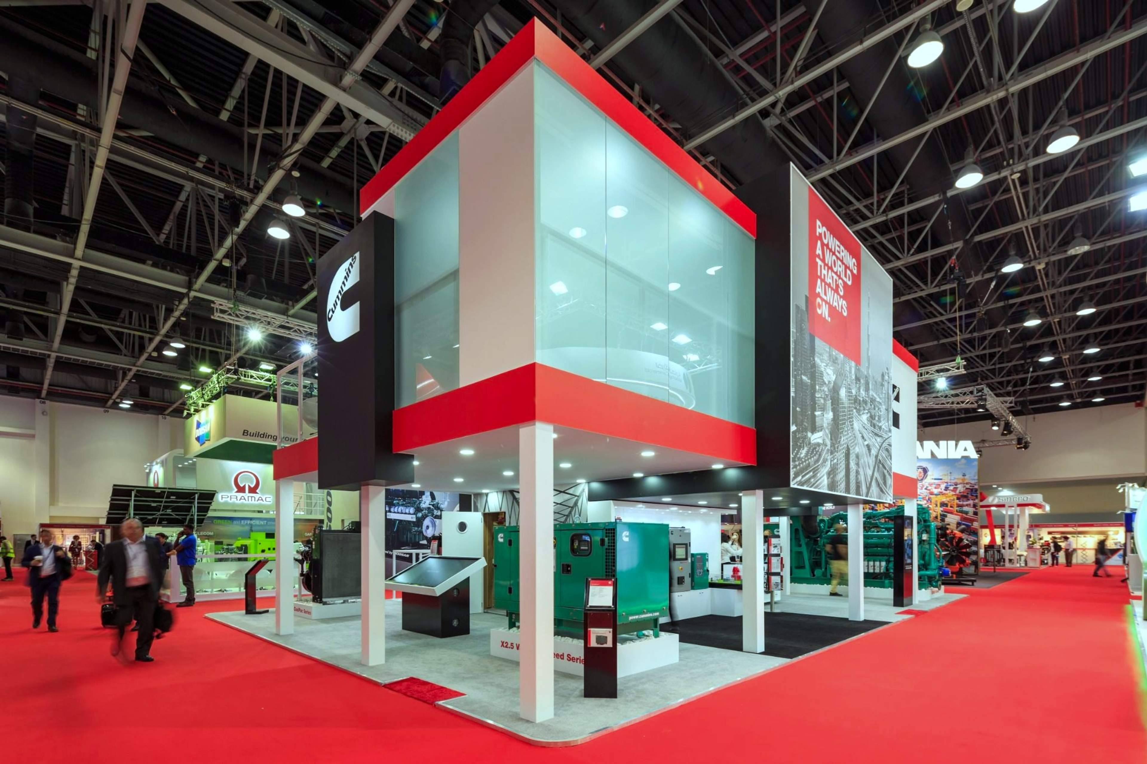 Two-storey Cummins exhibition stand with a glass upper deck and red branding at Middle East Energy, Dubai