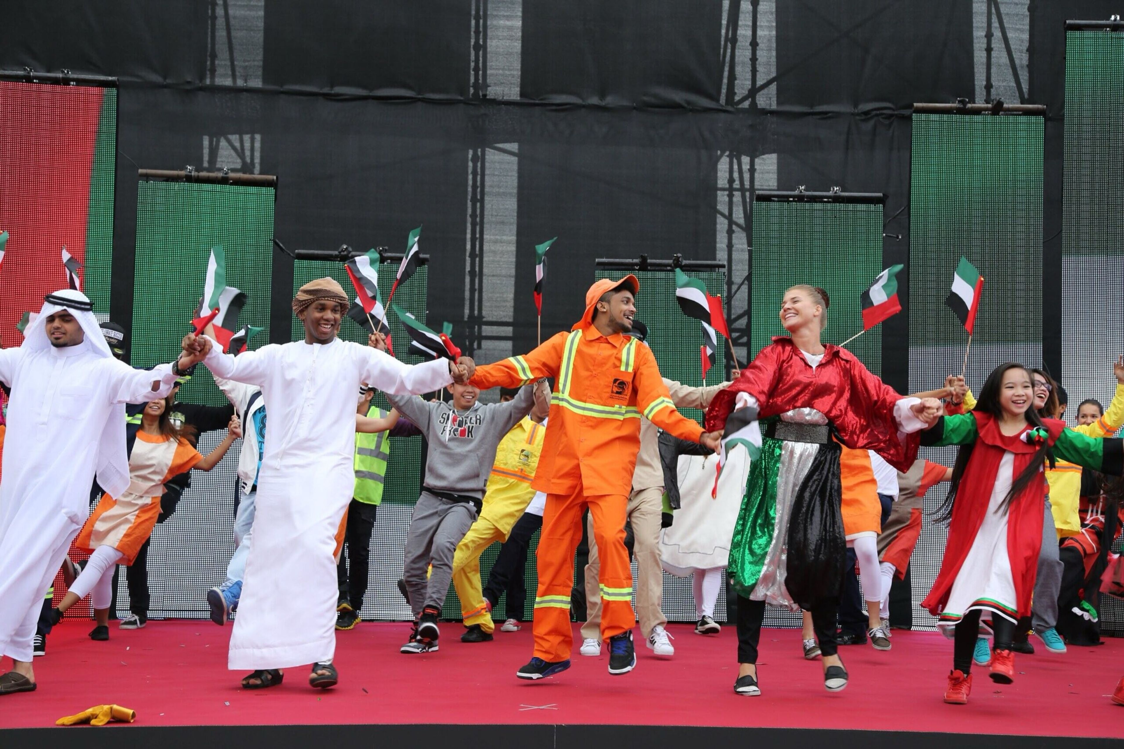 Folk dancers performing in traditional dress at a cultural event
