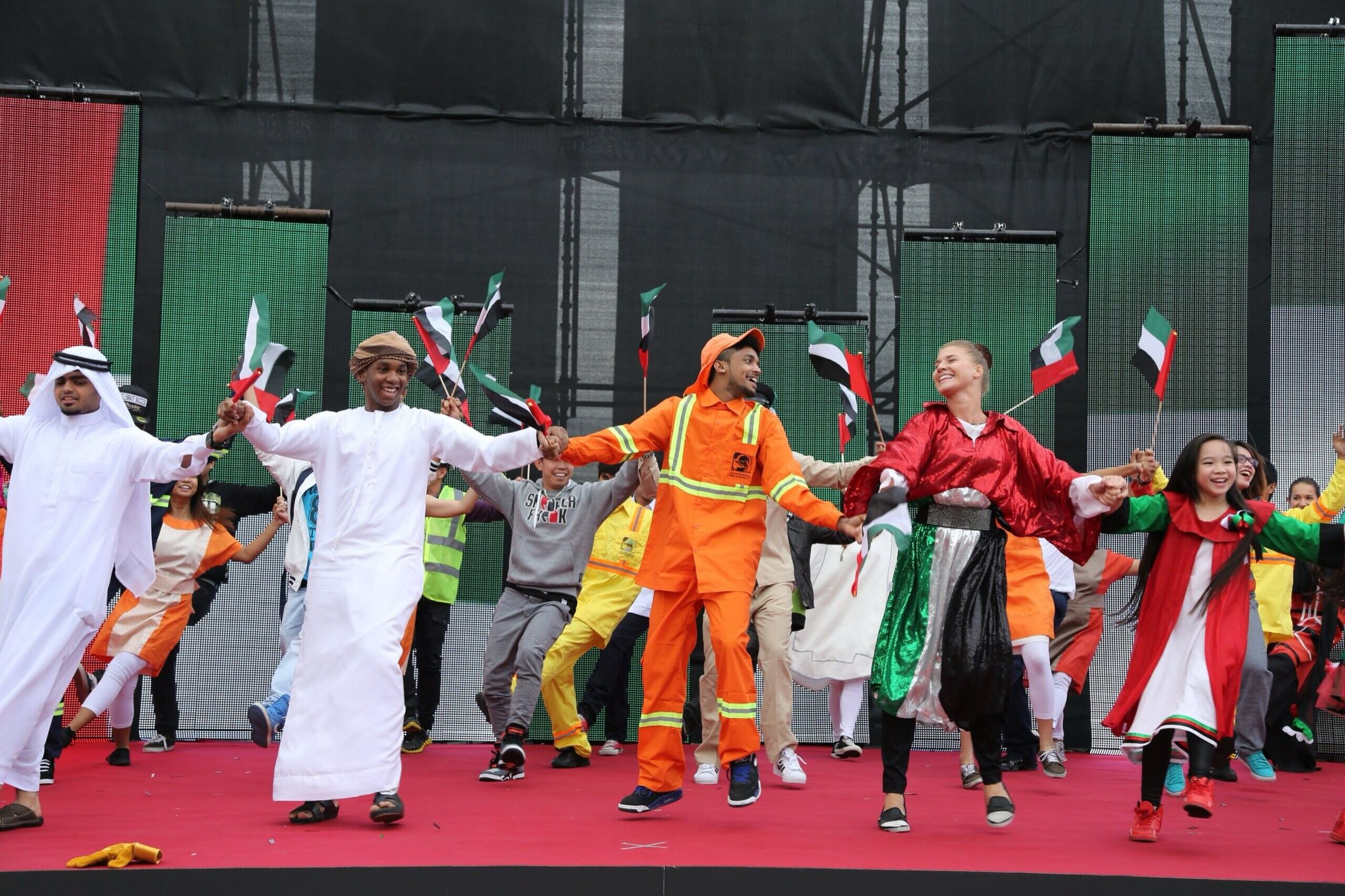 Folk dancers performing in traditional dress at a cultural event