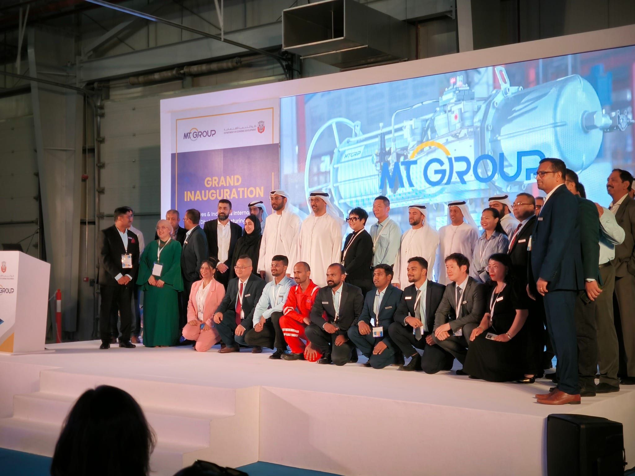 MT Group leadership and guests on stage at the facility grand inauguration