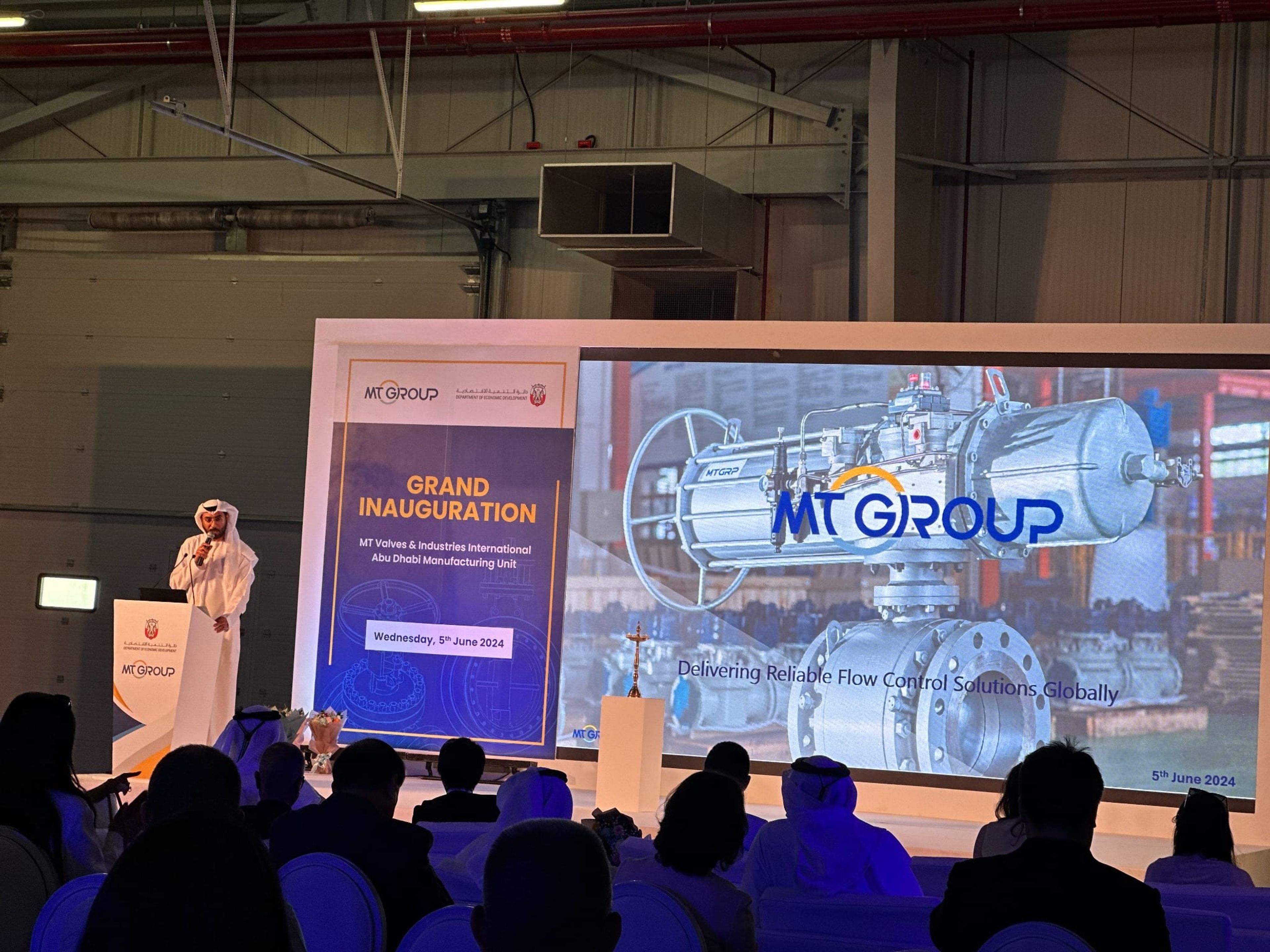 Speaker addressing guests at the MT Group grand inauguration in Abu Dhabi