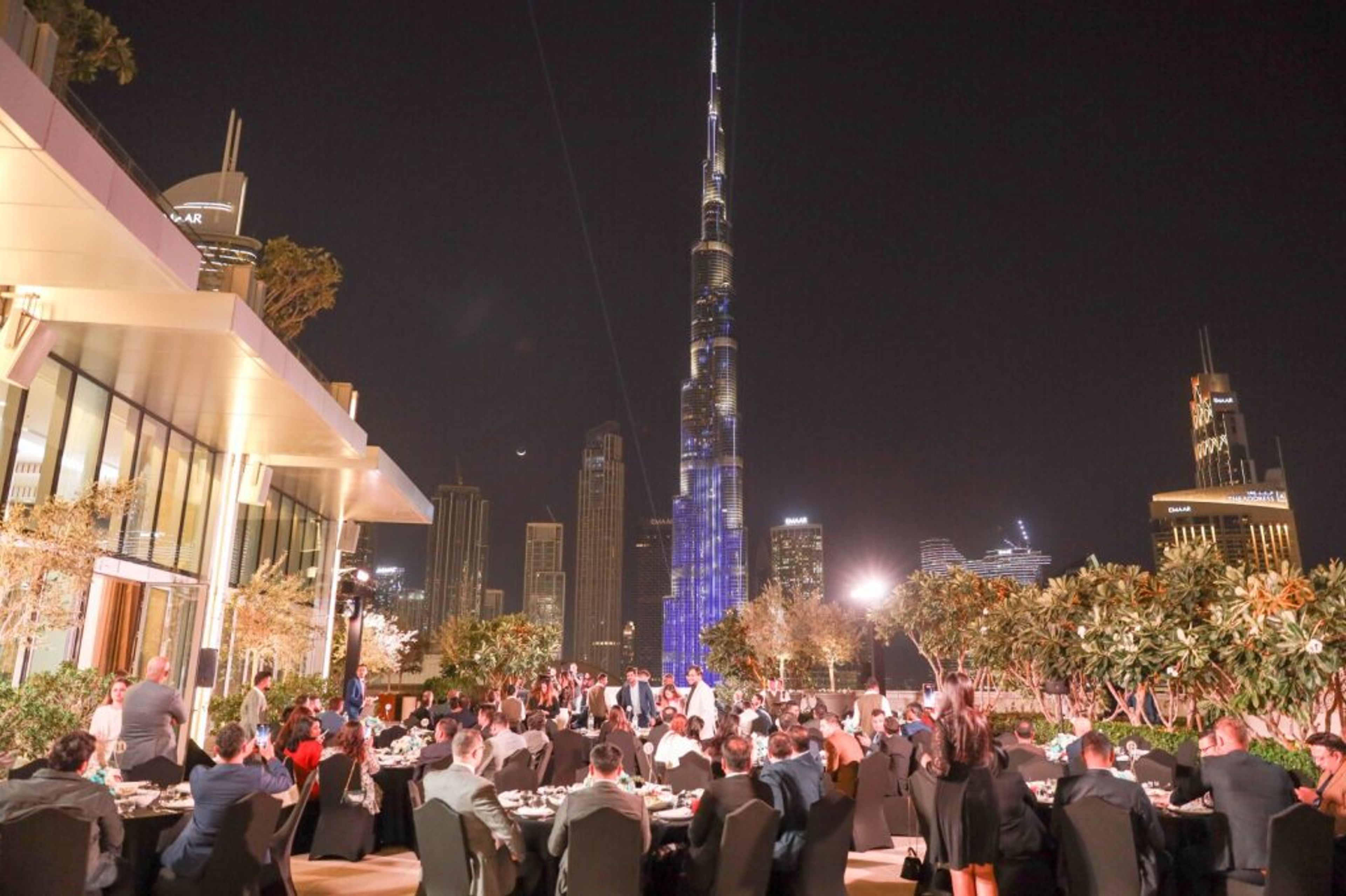 Outdoor evening event in Downtown Dubai with the Burj Khalifa behind