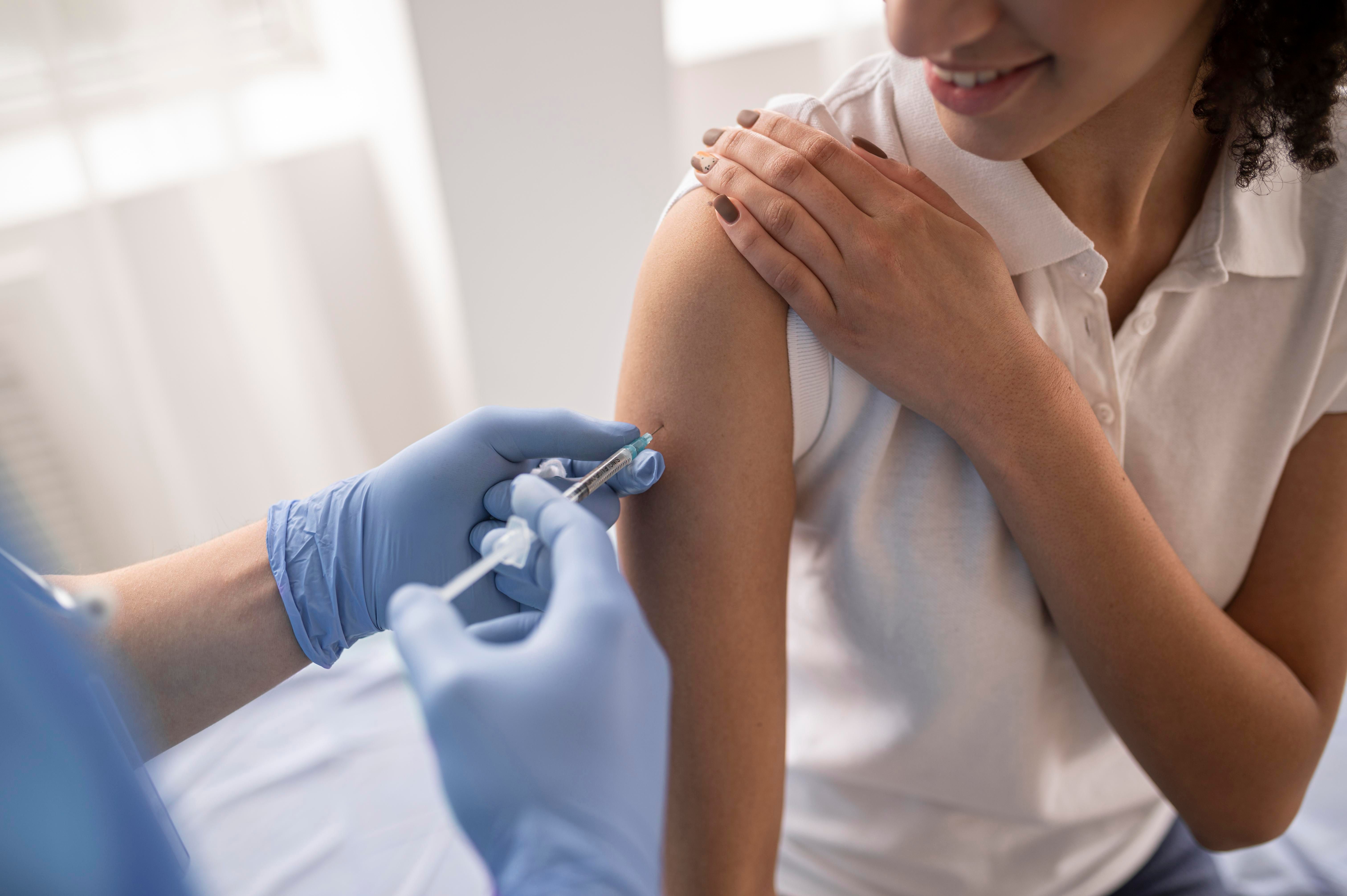 doctor-vaccinating-patient-clinic-3