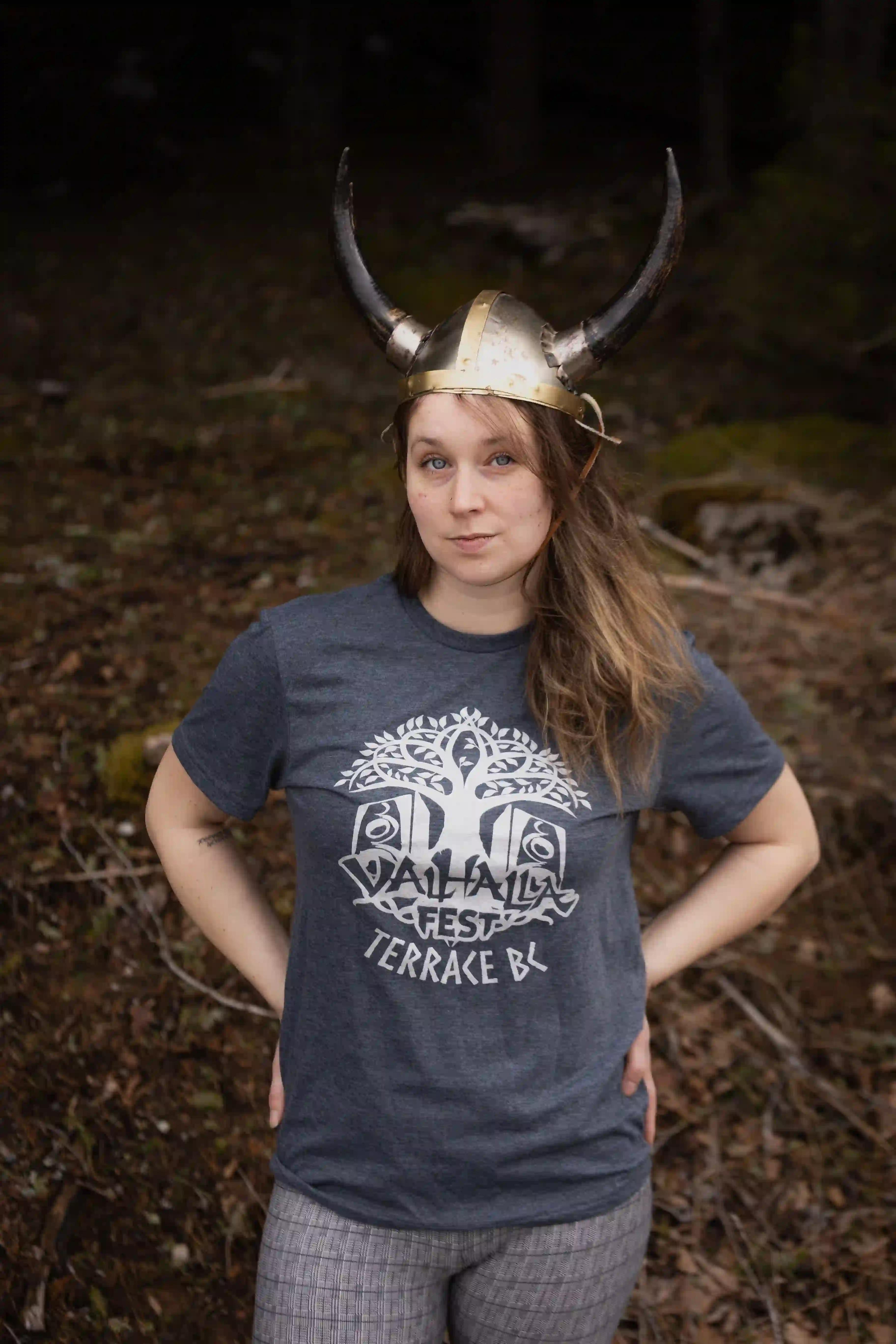 Woman in ValhallaFest t-shirt wearing Viking horned helmet
