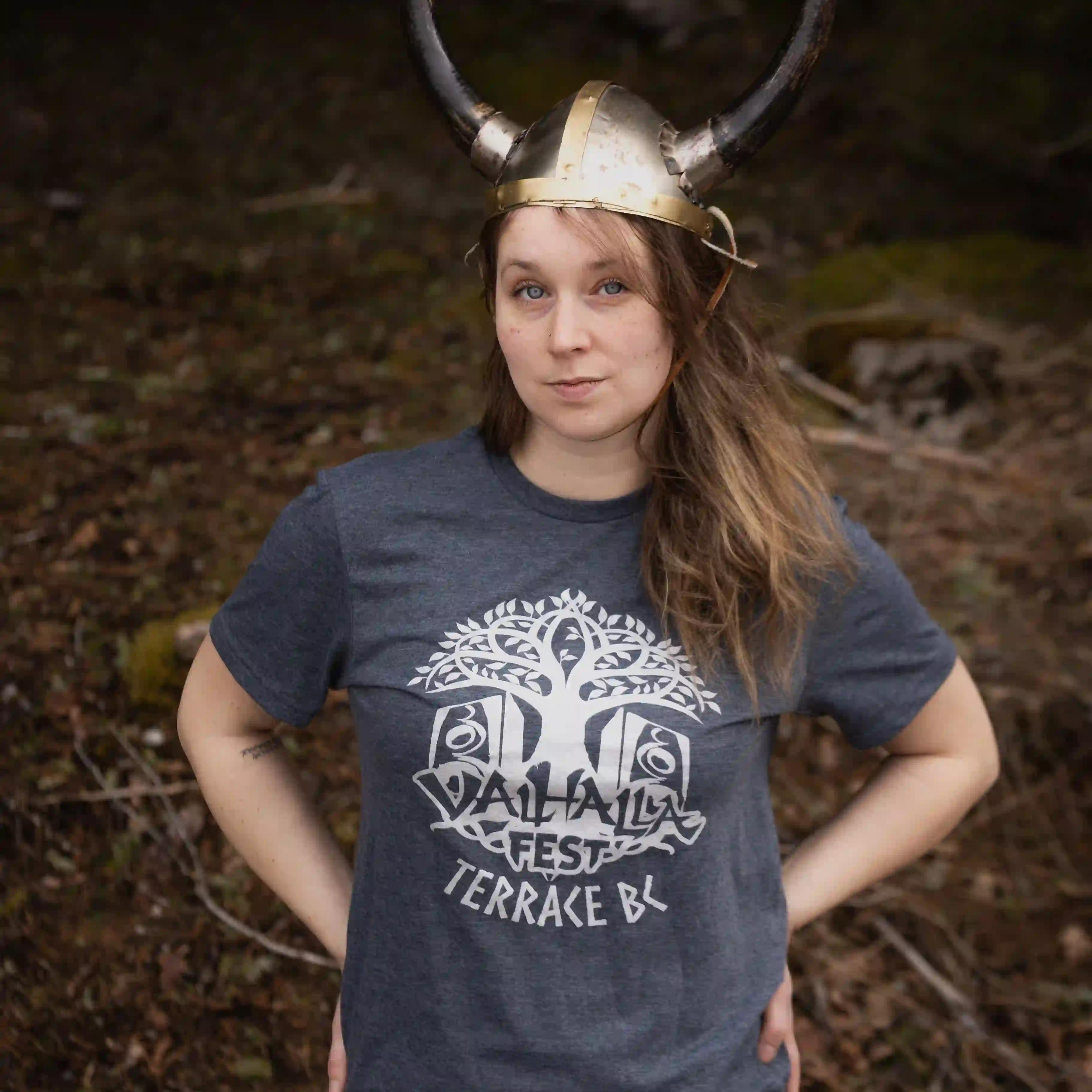 Woman in ValhallaFest t-shirt wearing Viking horned helmet