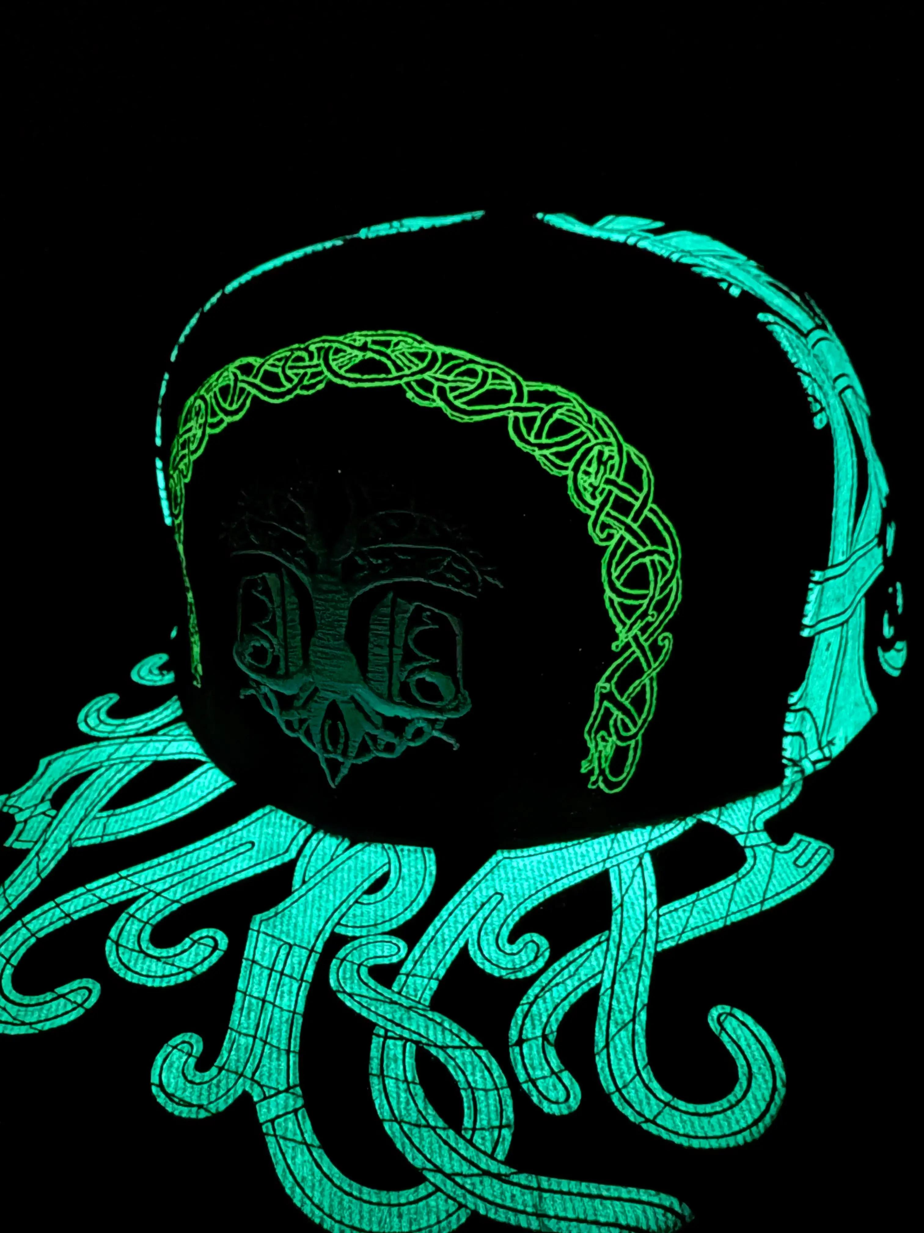 ValhallaFest glow-in-the-dark hat glowing in darkness