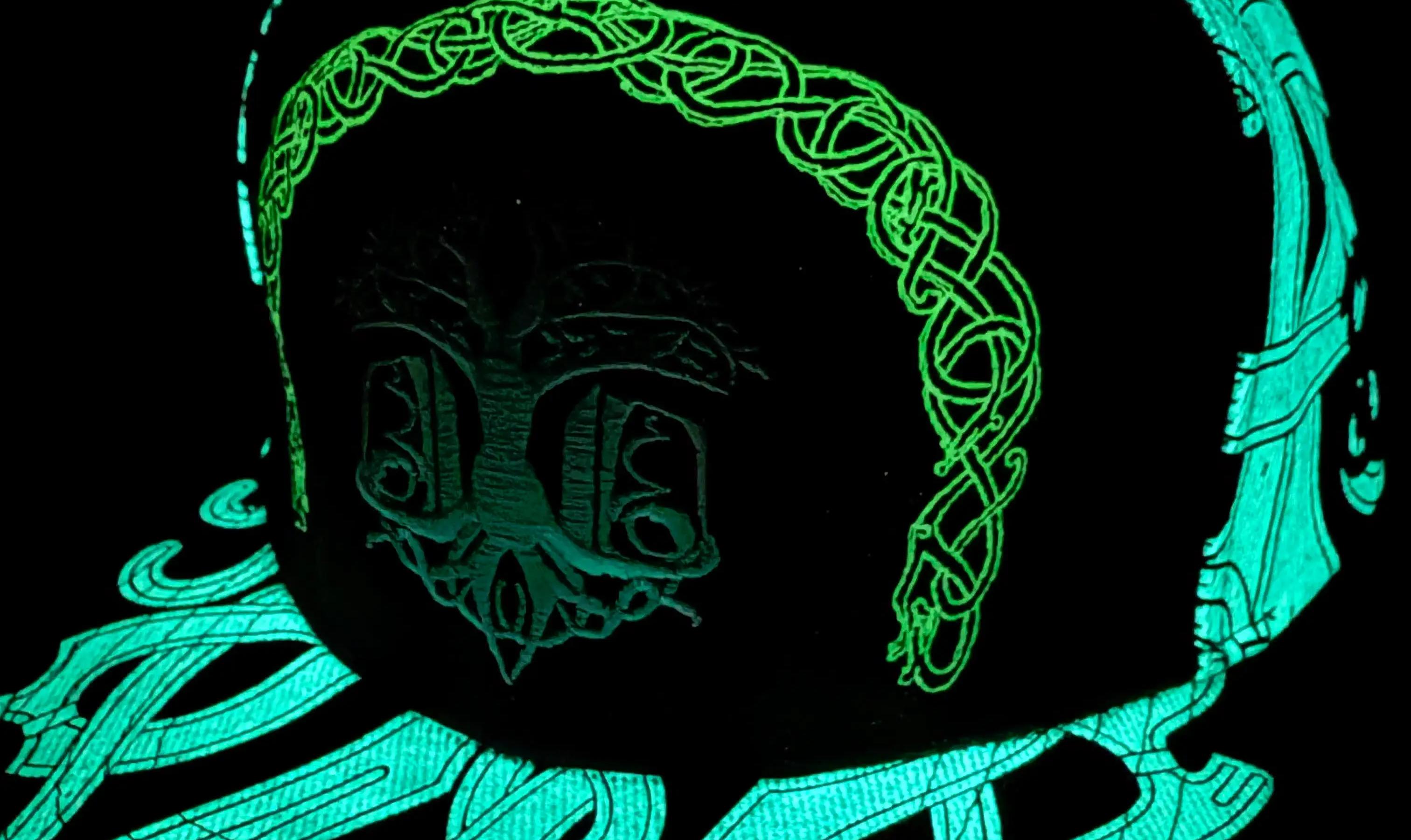 ValhallaFest glow-in-the-dark hat glowing in darkness