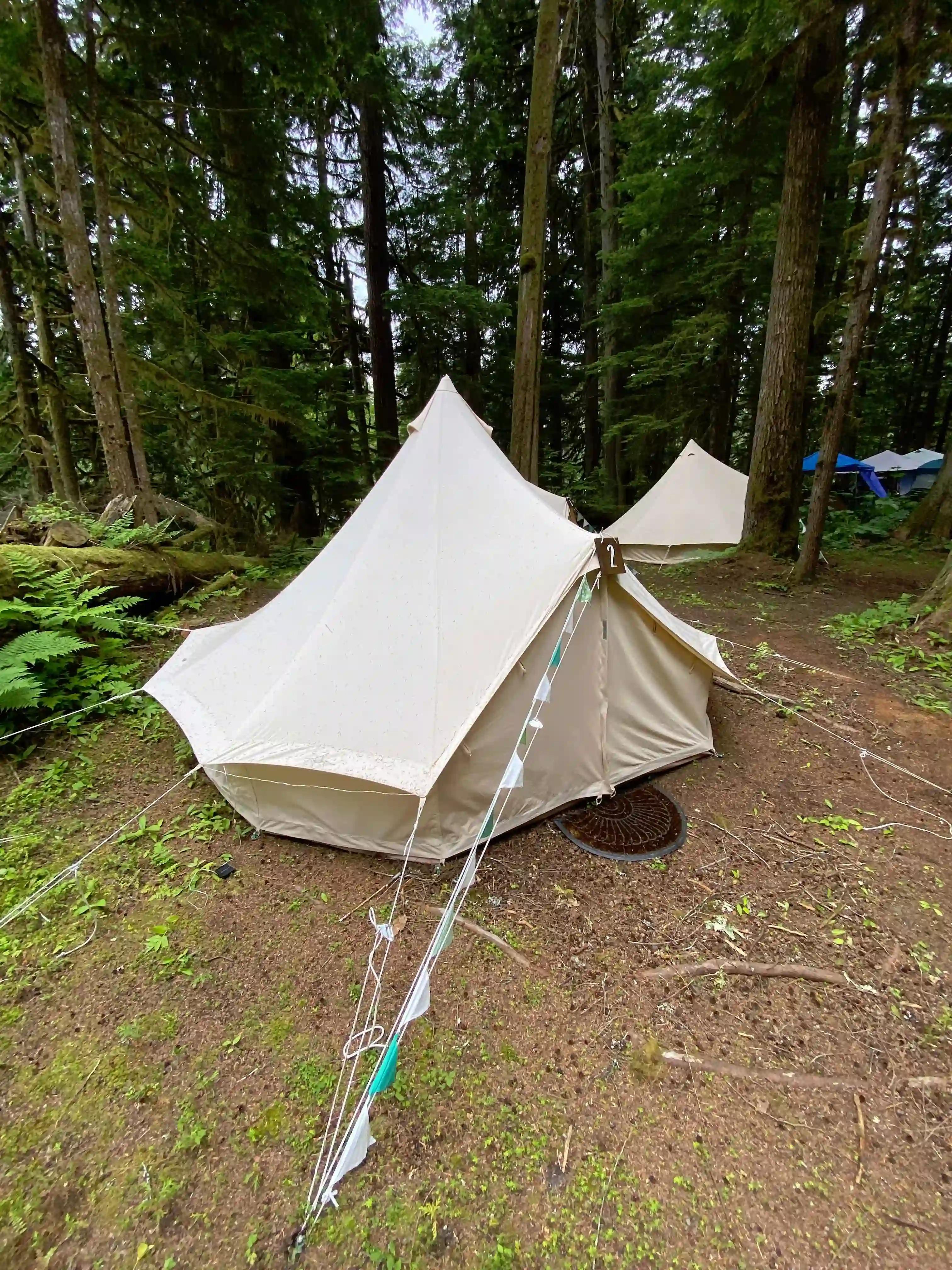 White canvas bell tent set up at ValhallaFest