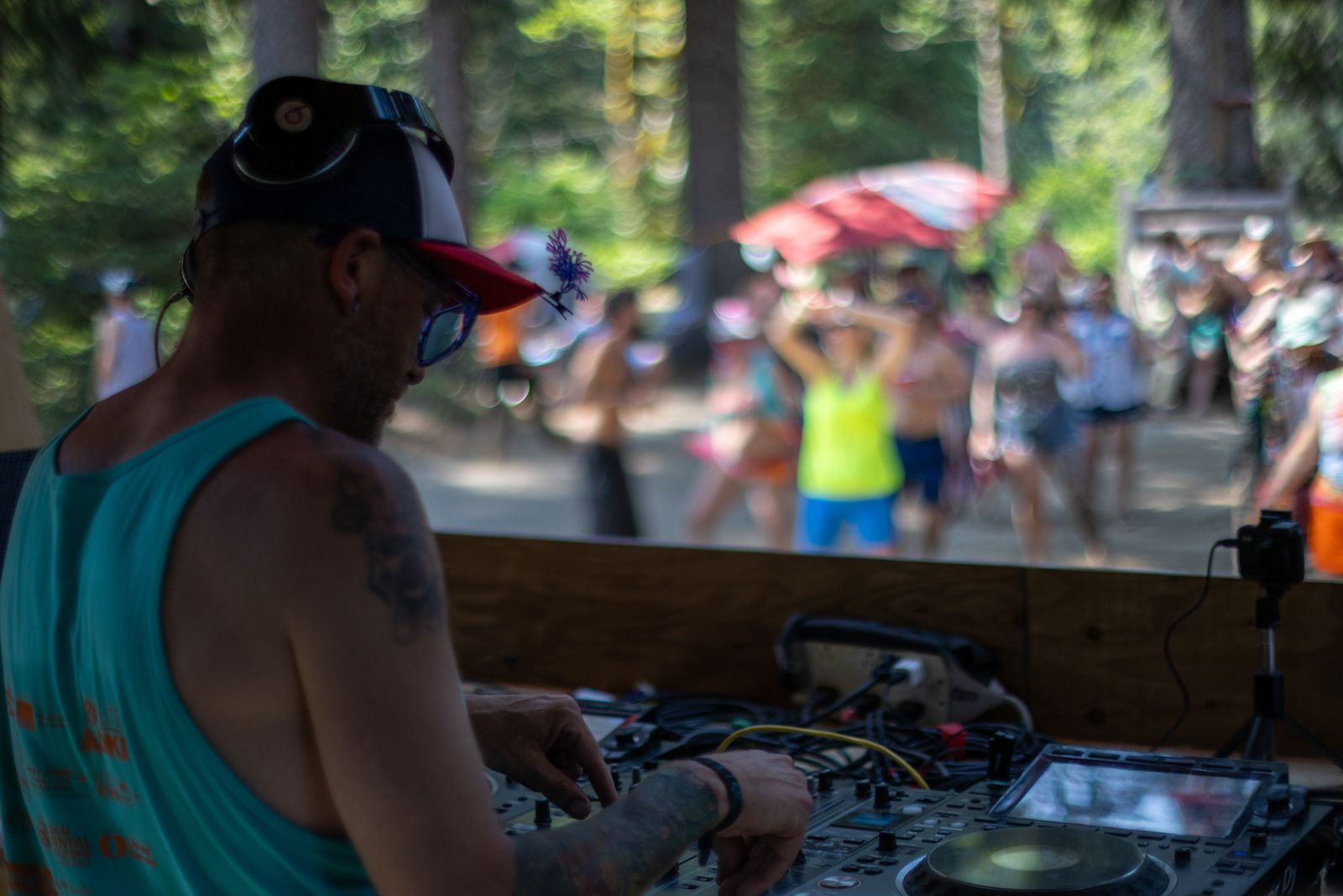 DJ performing at outdoor forest festival