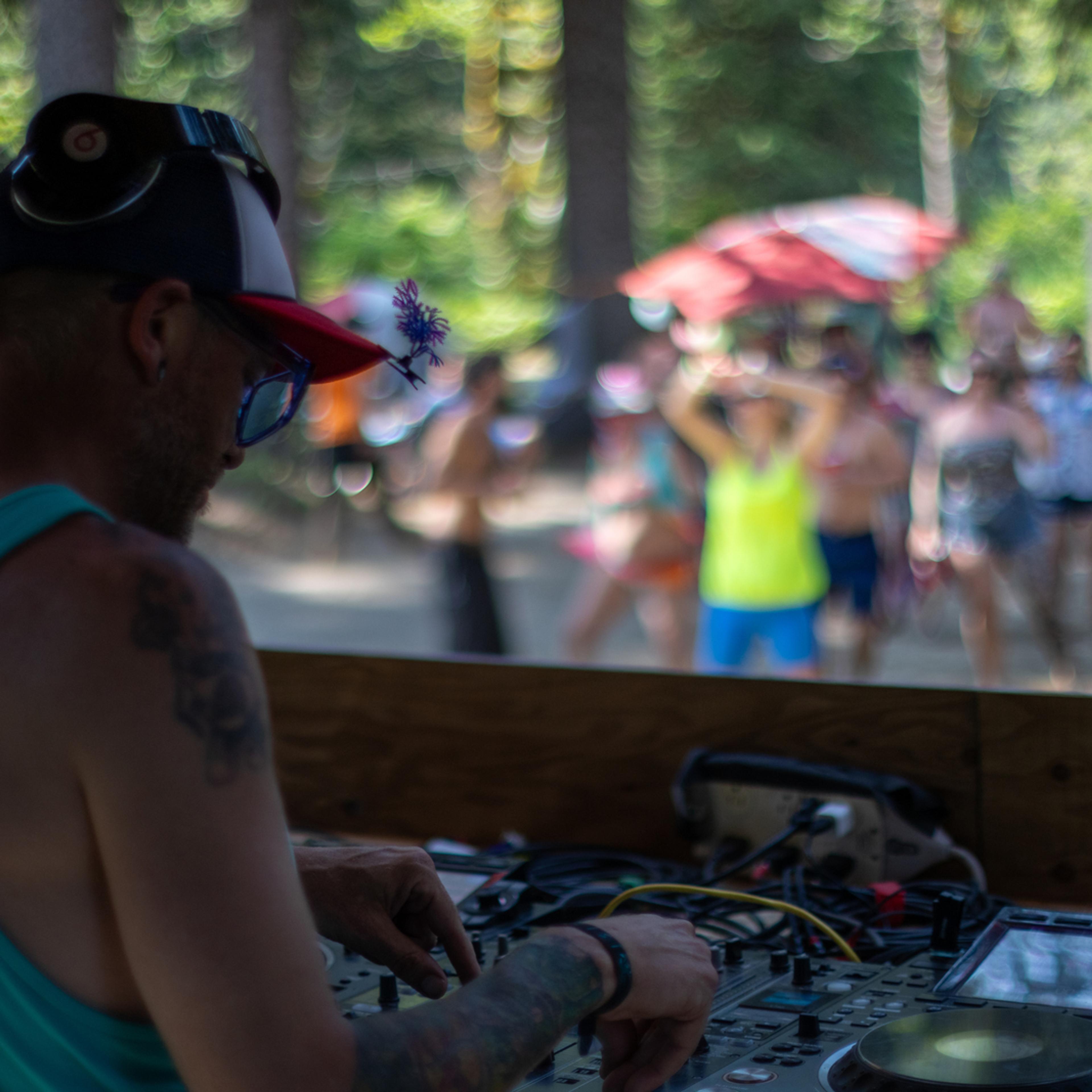 DJ performing at outdoor forest festival