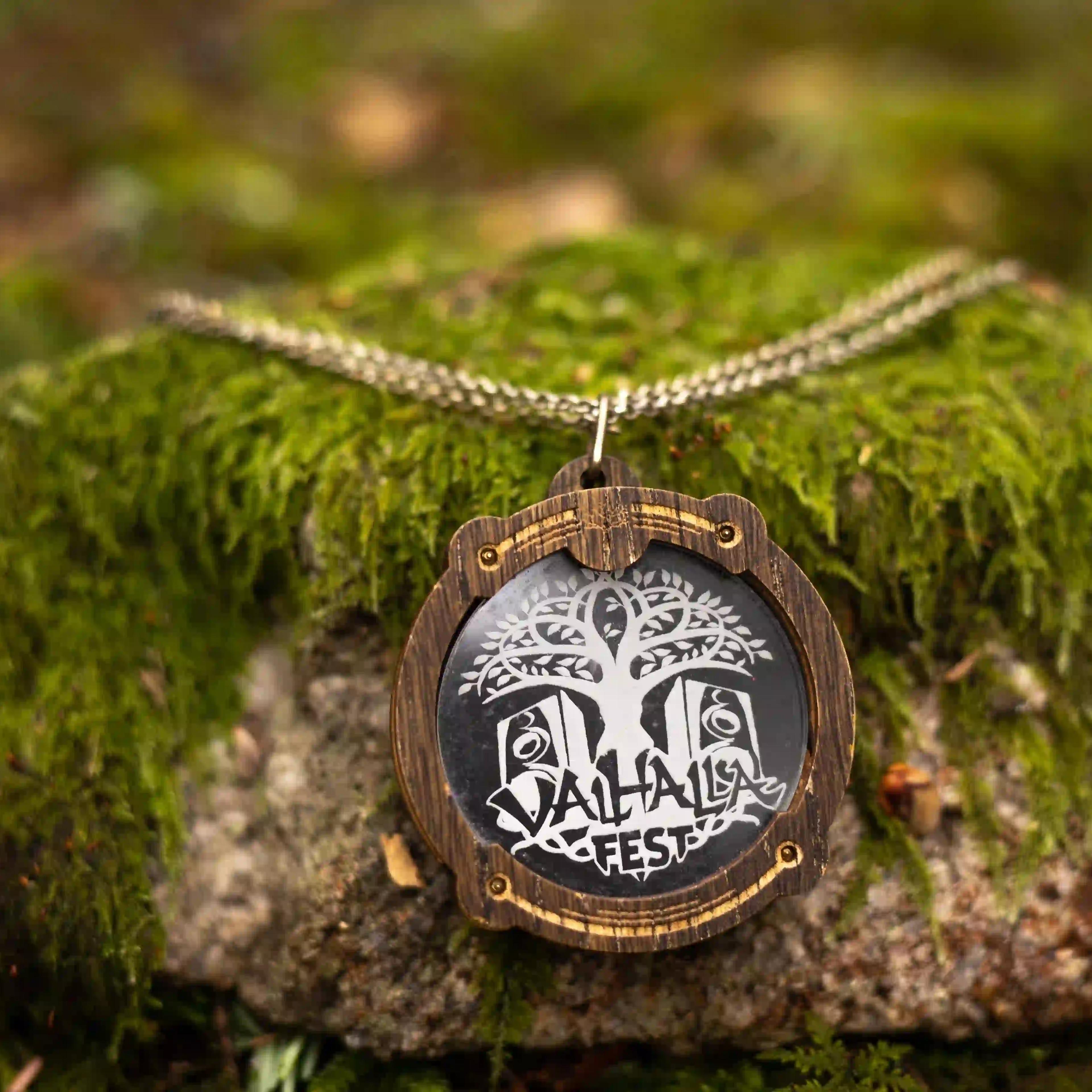 ValhallaFest wooden pendant necklace on a mossy rock