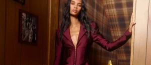 Woman wearing a burgundy blazer from Dolly's Joleans