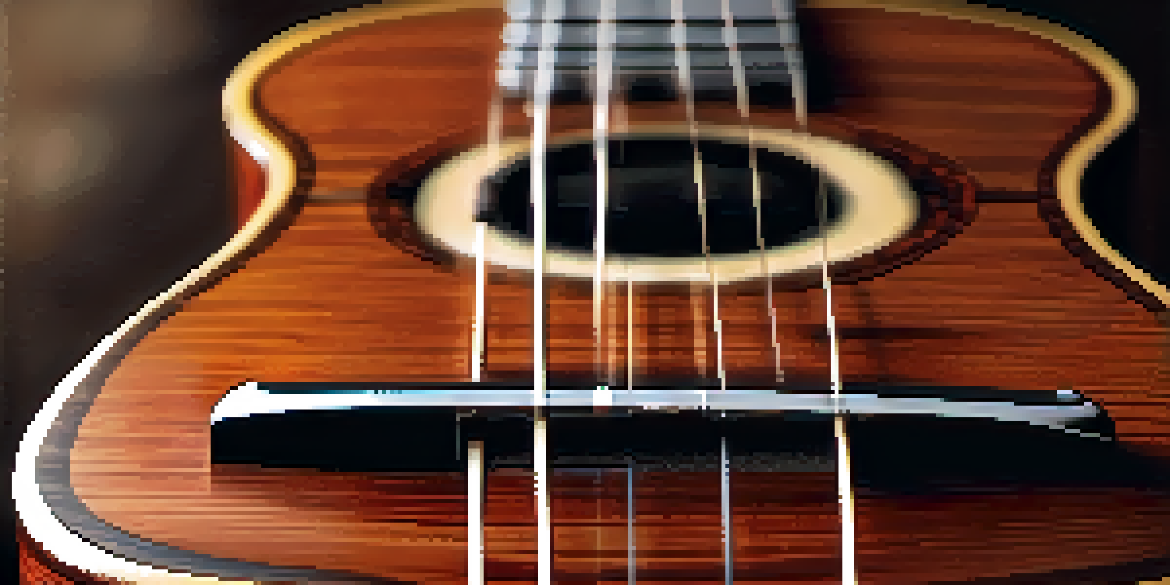 A close-up view of a mahogany soprano ukulele on a wooden table, emphasizing its grain and polished finish.