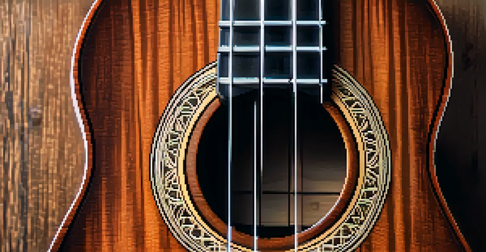 Close-up of a handcrafted Martin ukulele on a rustic wooden table, highlighting its wood grain and intricate details.