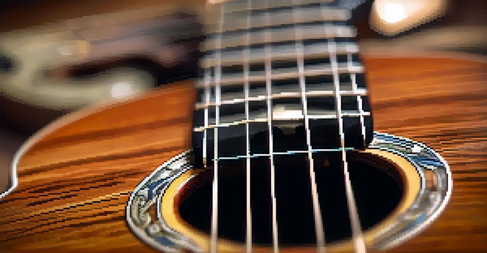 A detailed close-up of a capo on a ukulele, with warm lighting and a blurred background.