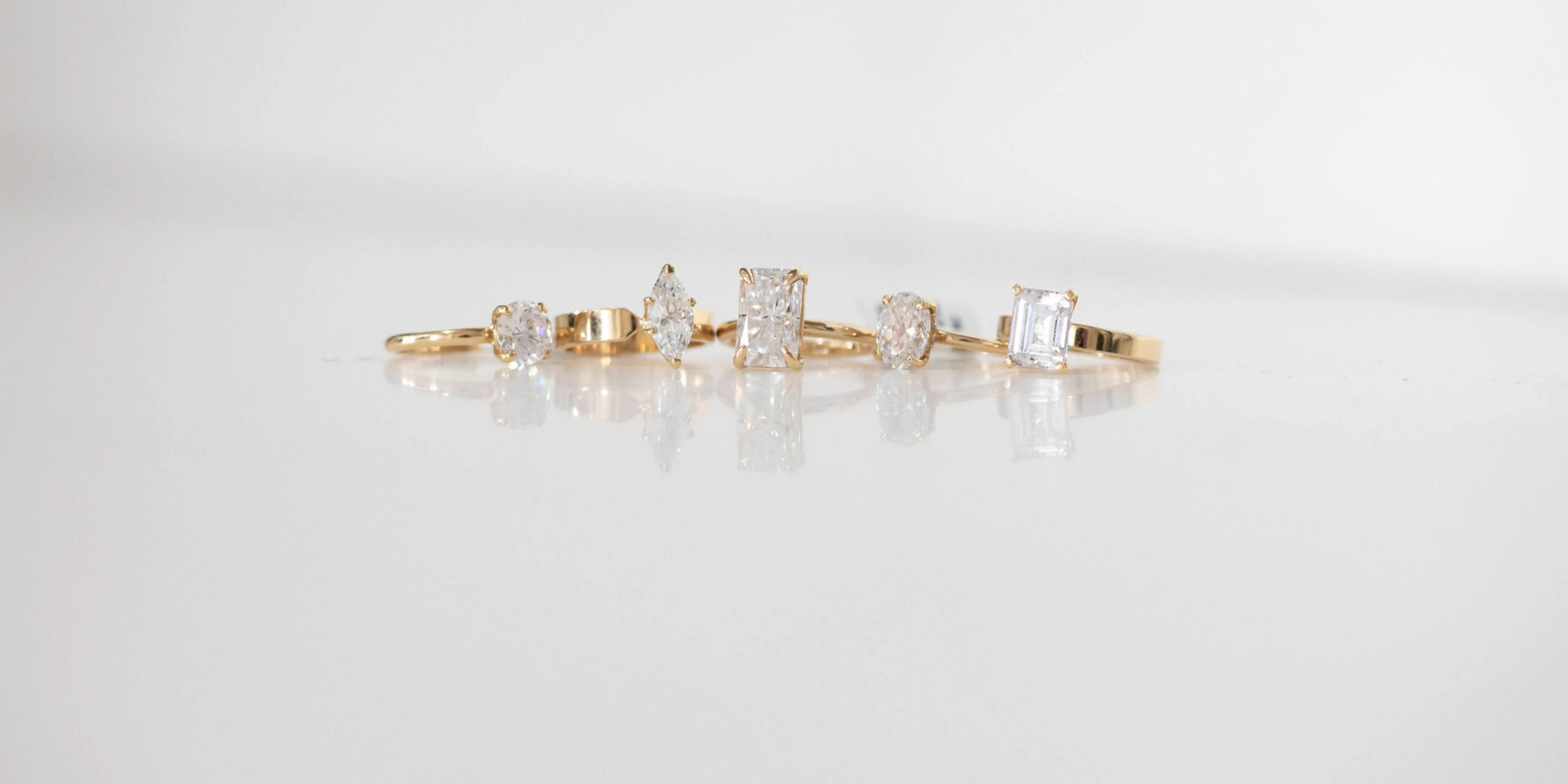 a row of diamond rings against a plain white background