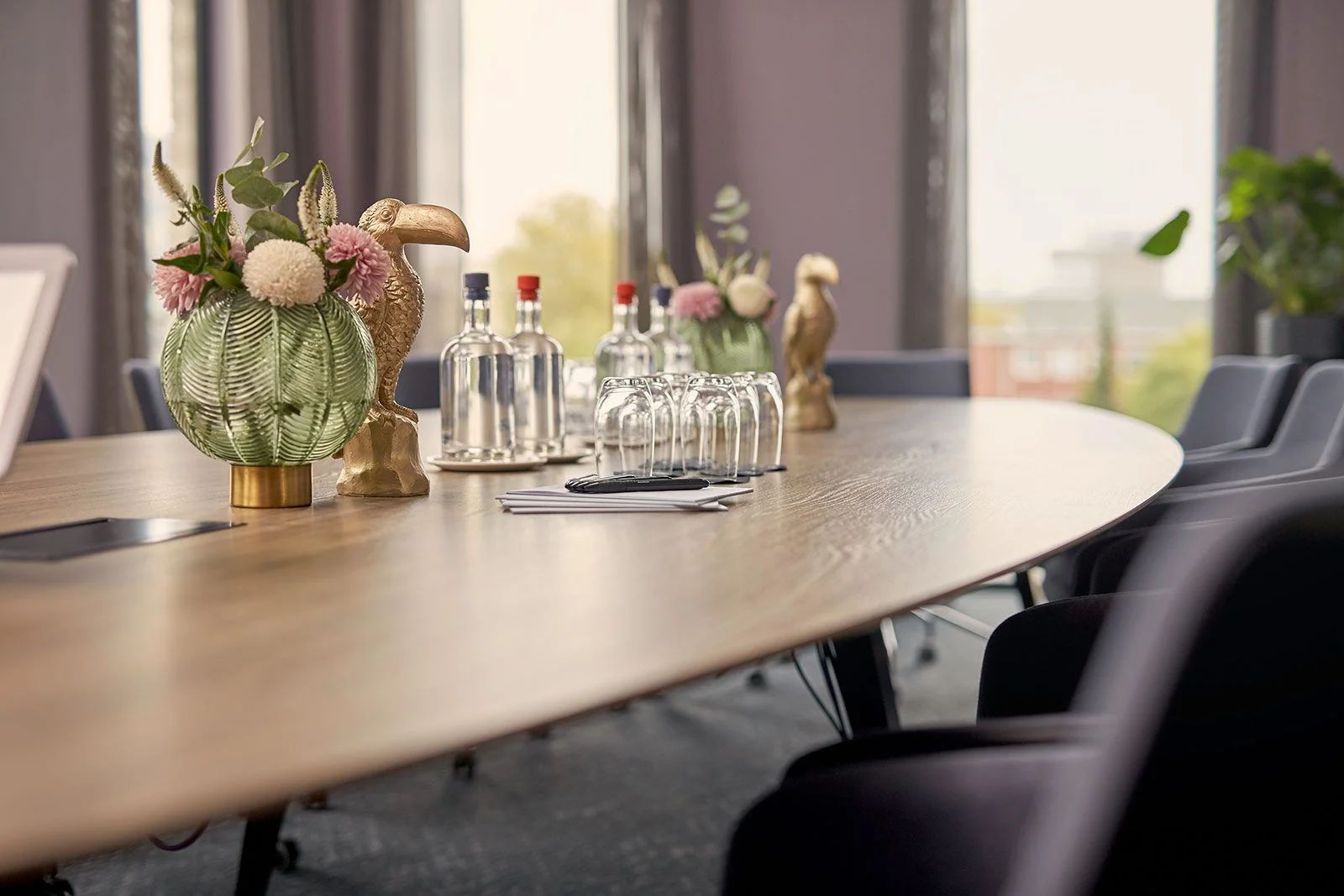 Gold toucan statues on a meeting room table
