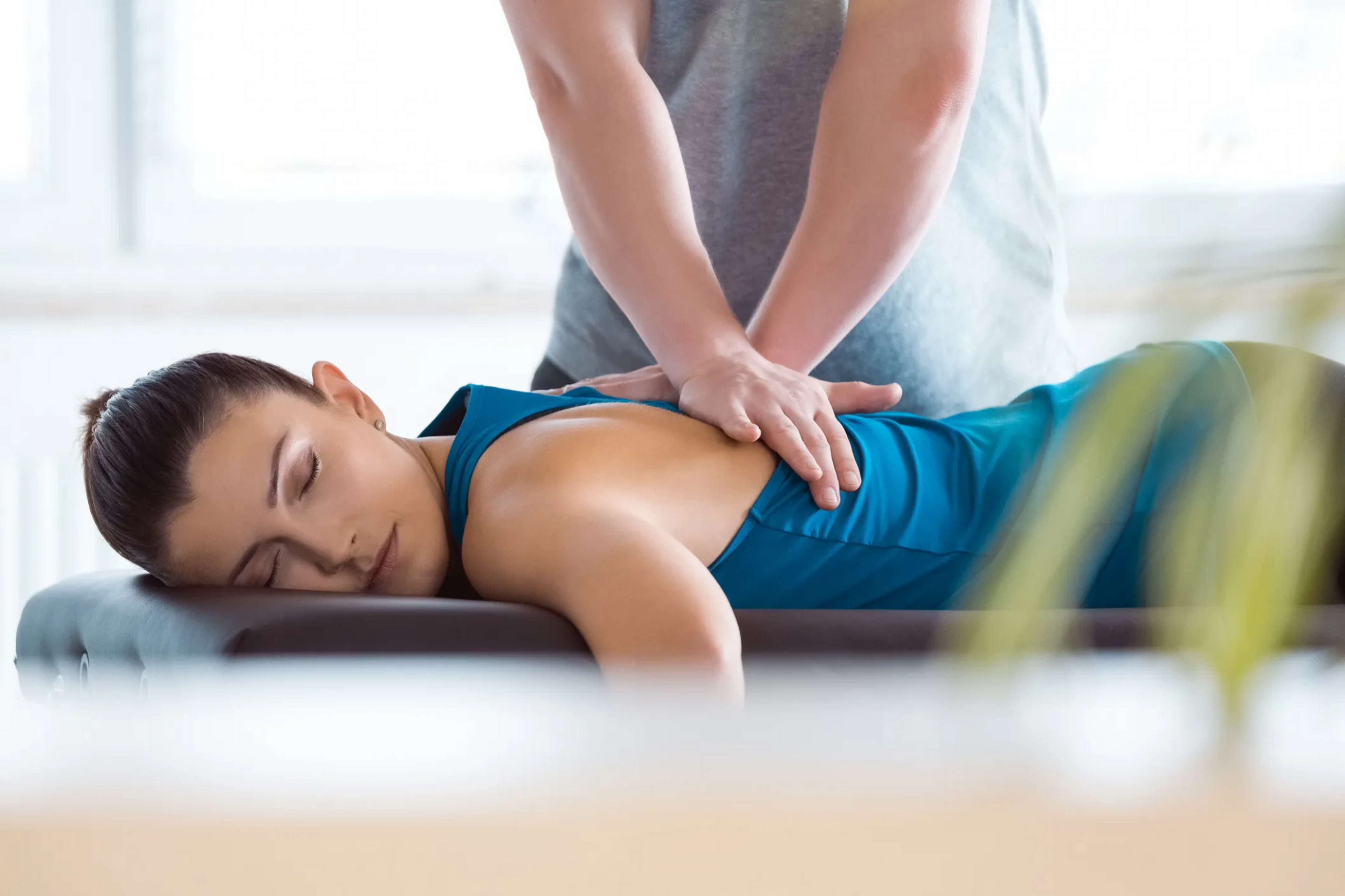 Chiropractor working with patient