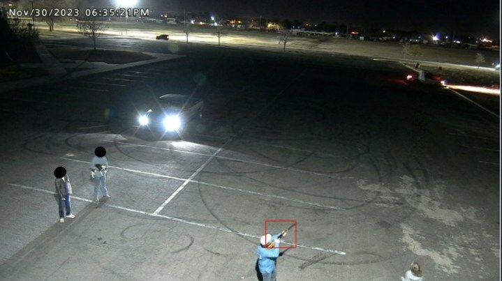 Man with gun in parking lot