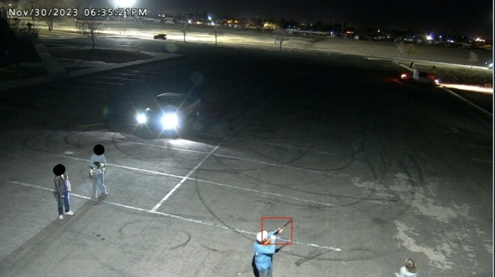 Man with gun in parking lot