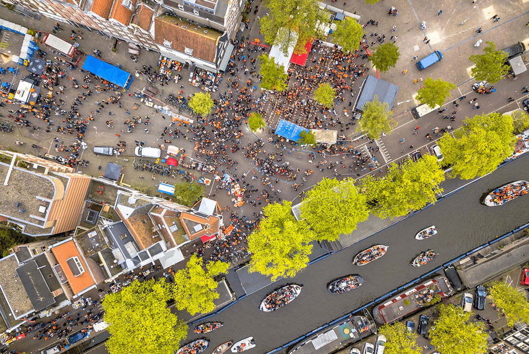 an aerial view of a city with boats in the water
