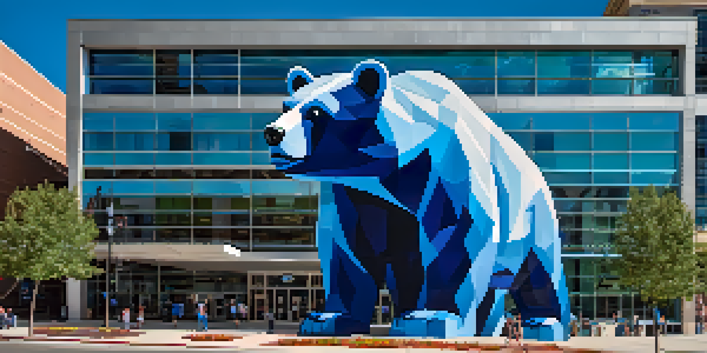 A large blue bear mural peeking into a modern building, under a clear blue sky.