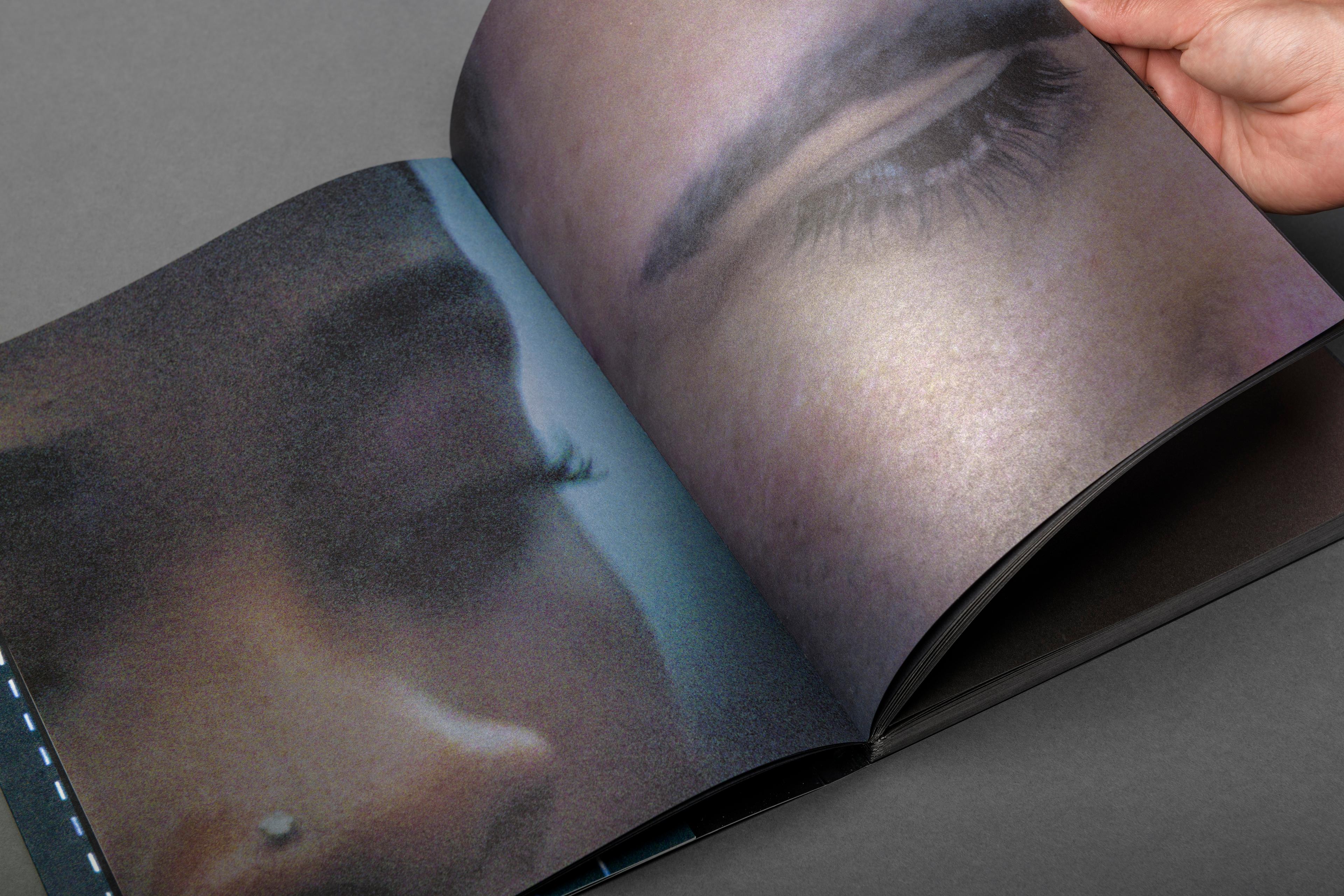 Close up of a page in the photo book SYNC.