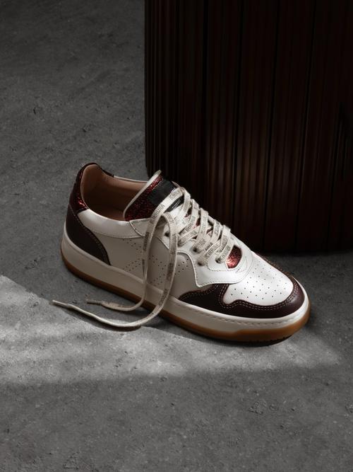 Sneaker creative photography on concrete with hard shadow — GoPackshot studio