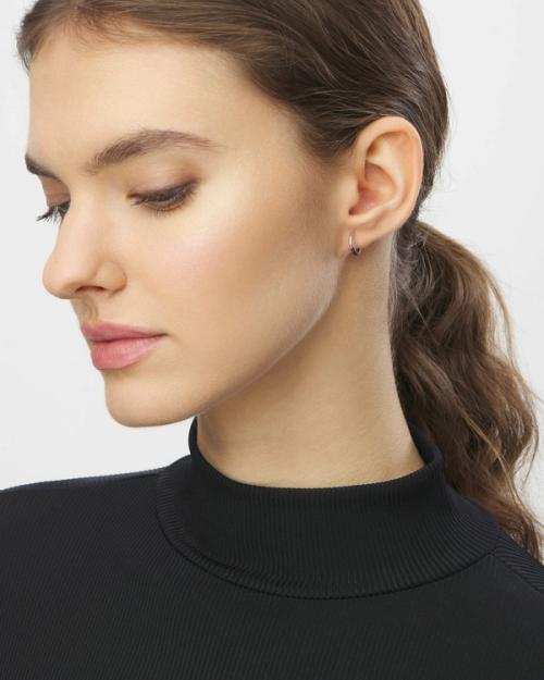 Earring on-model profile portrait showing hoop fit — jewellery photography GoPackshot