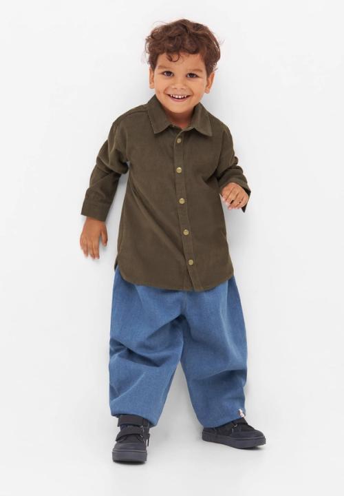 Kids shirt and jeans on-model photography in studio — childrenswear ecommerce GoPackshot