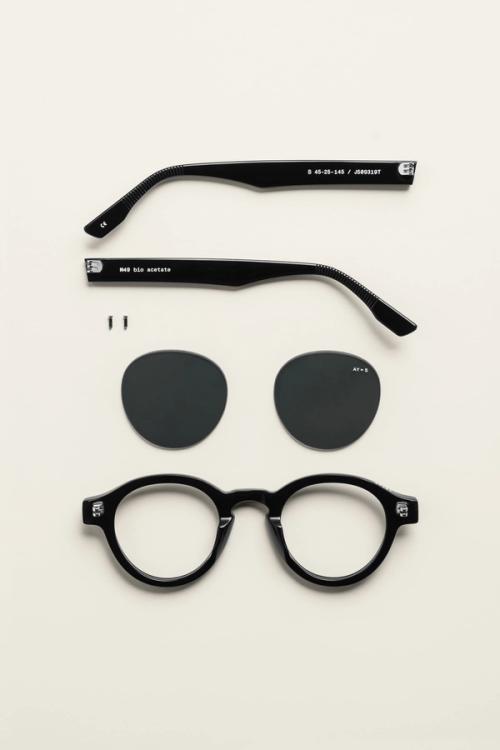 Sunglasses deconstructed flat-lay with round lenses — eyewear photography GoPackshot