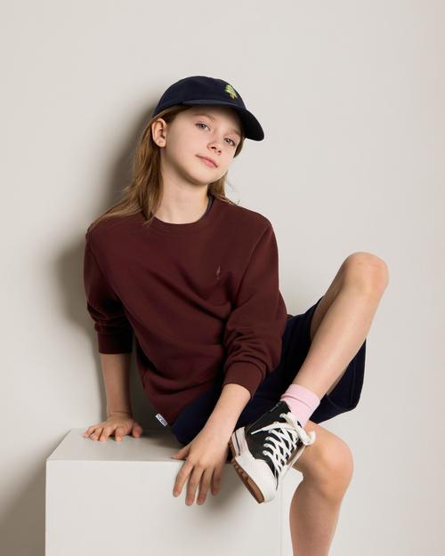 Kids sweatshirt and cap on-model photography in studio — childrenswear GoPackshot