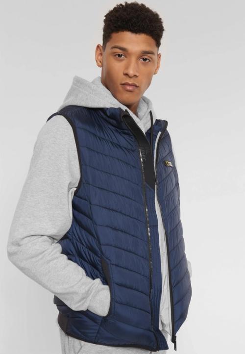 Vest on-model layered photography in studio — menswear GoPackshot