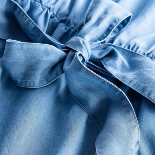 Denim waist bow detail photography — studio close-up GoPackshot