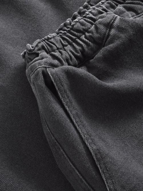 Jeans elastic waistband detail — studio macro GoPackshot