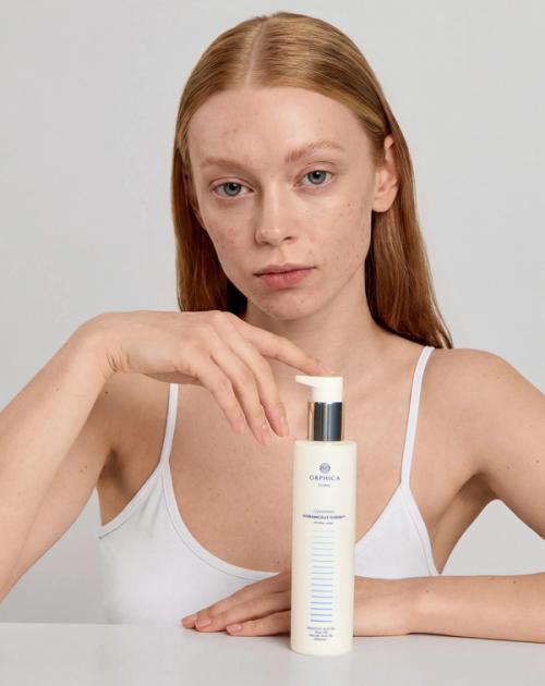 Micellar water bottle on-model skincare photography — GoPackshot studio