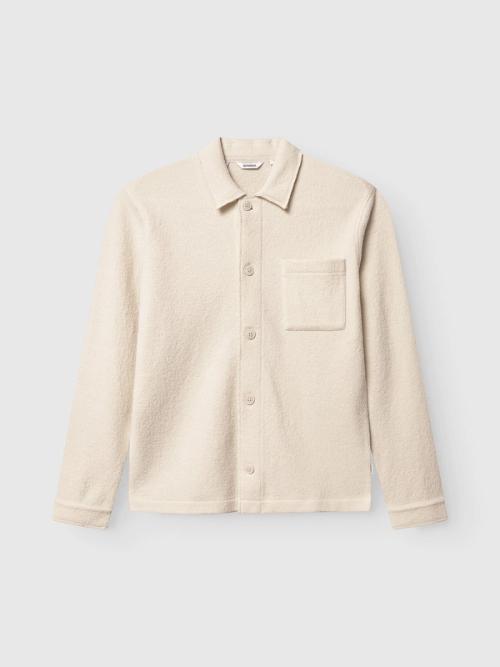 Shirt flat-lay packshot on light background — ecommerce GoPackshot