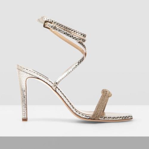 Heel side profile packshot with ornate strap on grey — GoPackshot studio