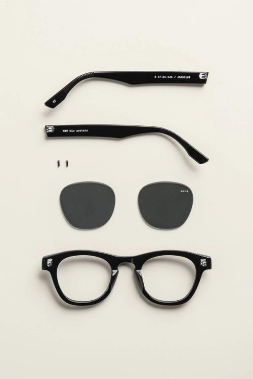 Sunglasses deconstructed flat-lay showing all components — eyewear photography GoPackshot